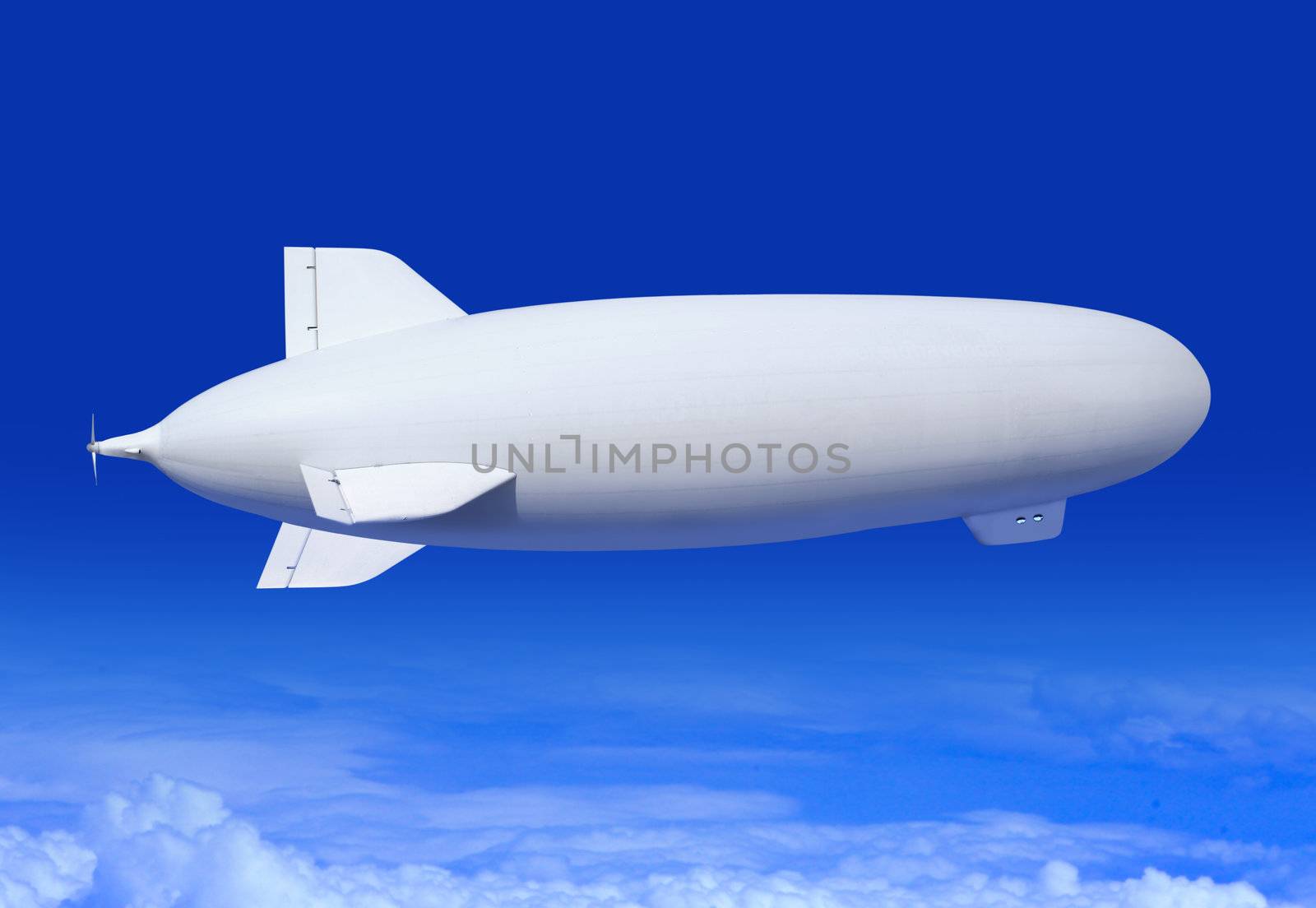 white airship in the blue sky landing away