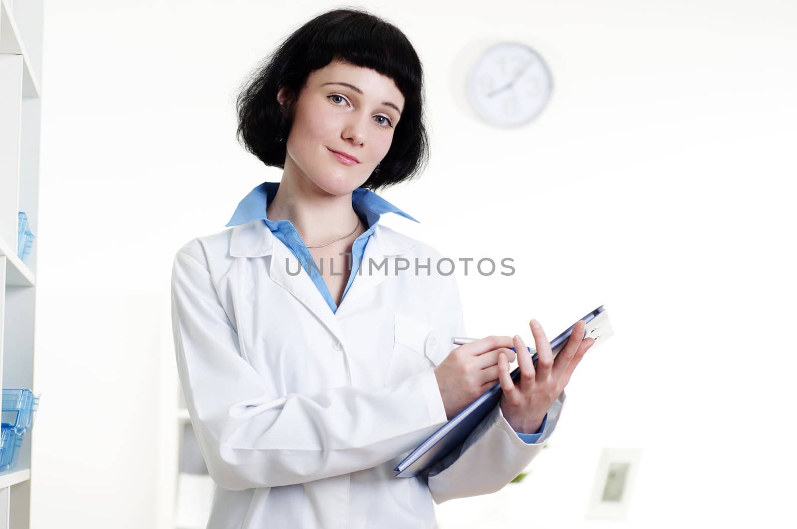 doctor with a tablet, does a note