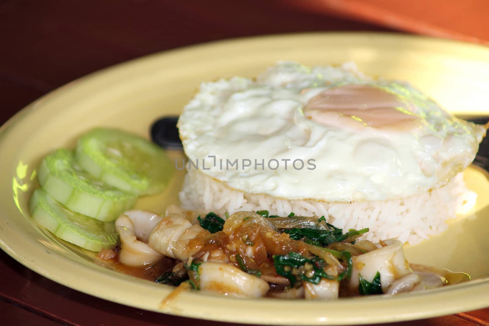 Thailand fast food rice and Fried egg with spicy Squid popular food in thailand