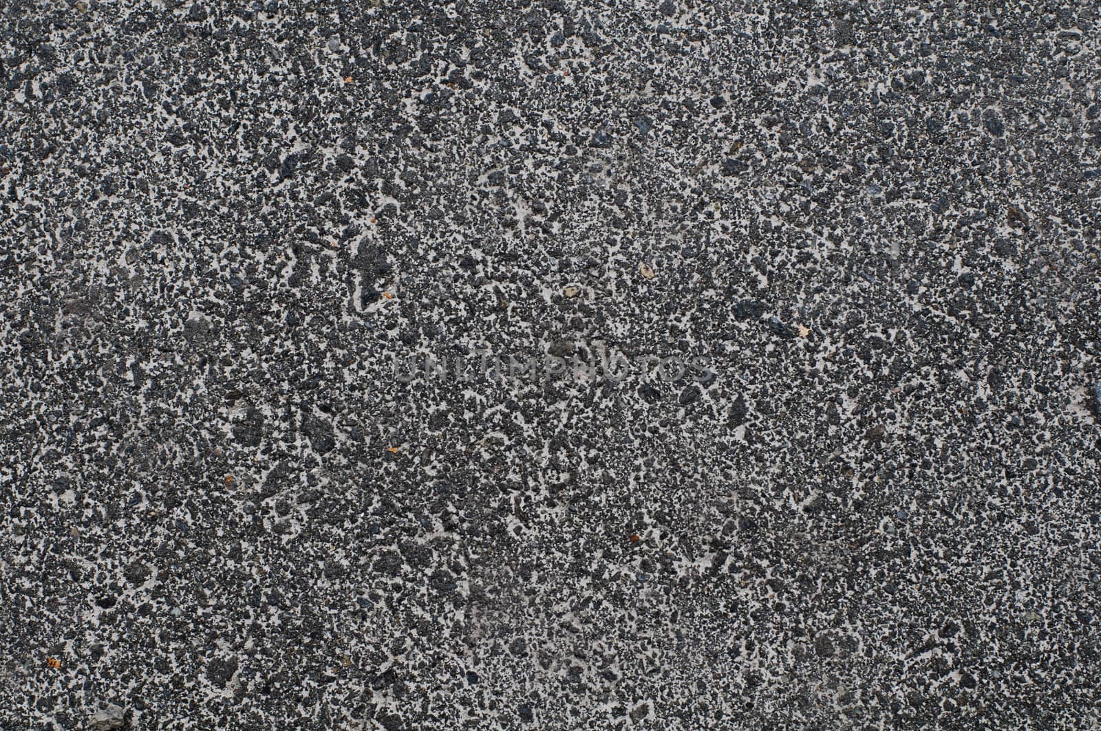 Photo of gray asphalted surface background. Close up