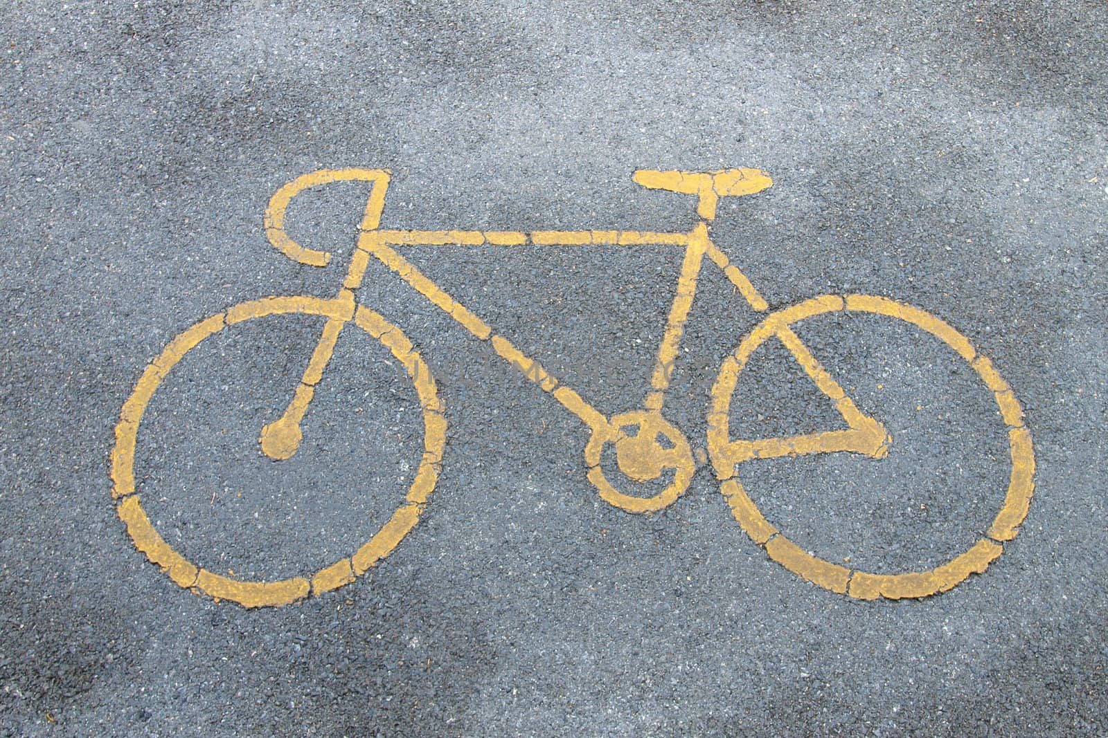 Bicycle road sign painted on the pavement.