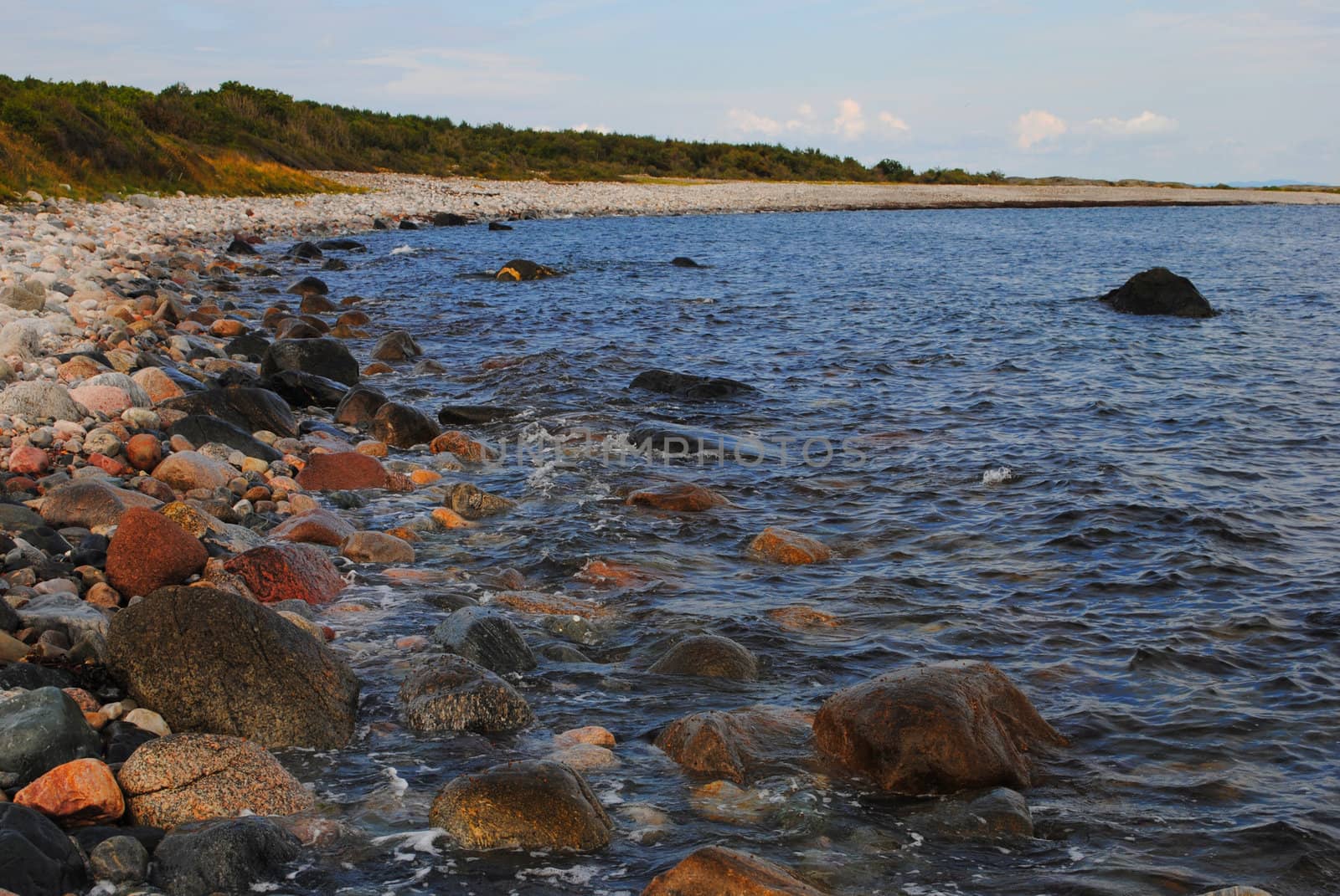 Rolling stone beach at Jomfruland, a small elongated Norwegian island located off the coast of mainland Kragerø in the county of Telemark.