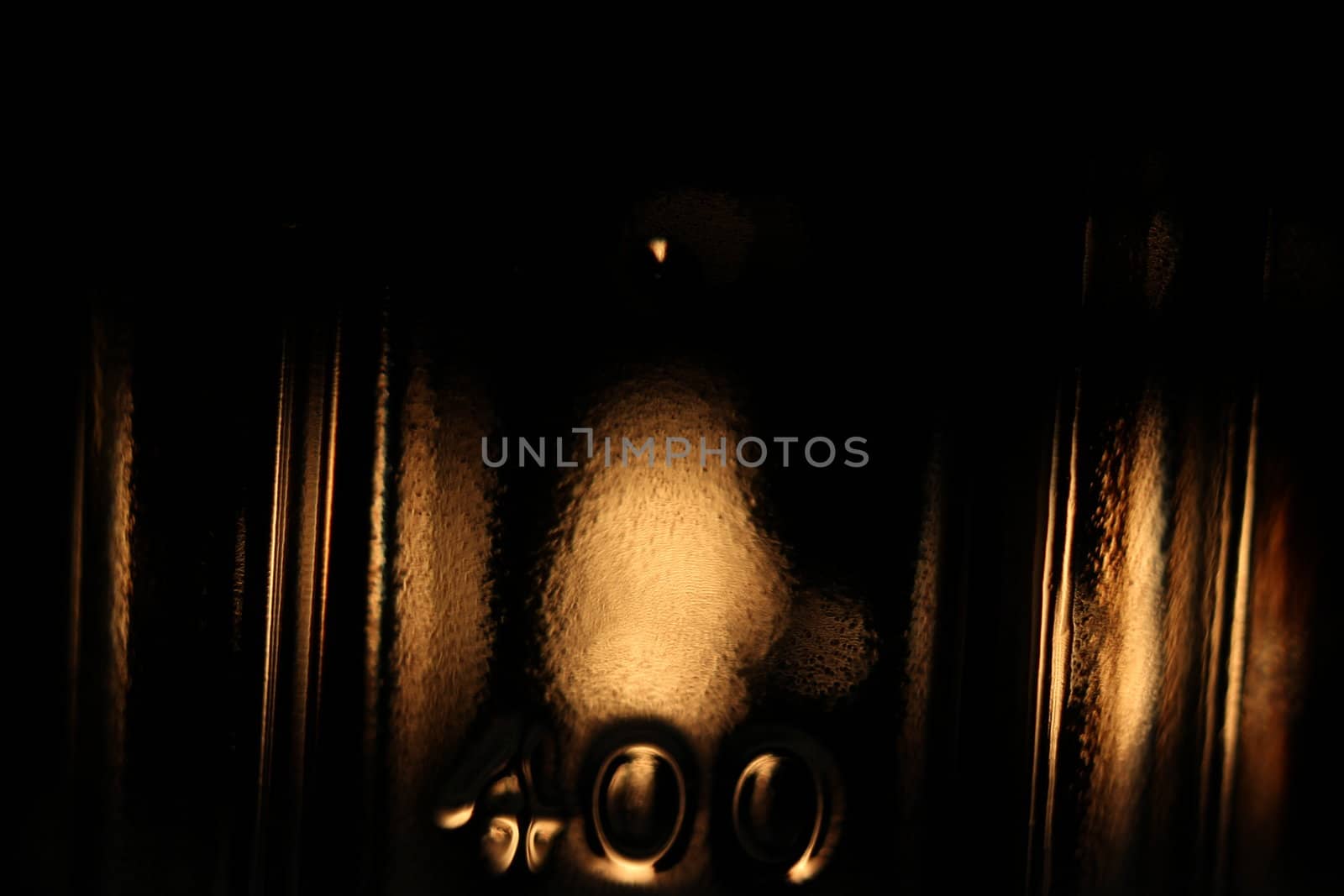 fine abstract image of glass bottle in the dark   