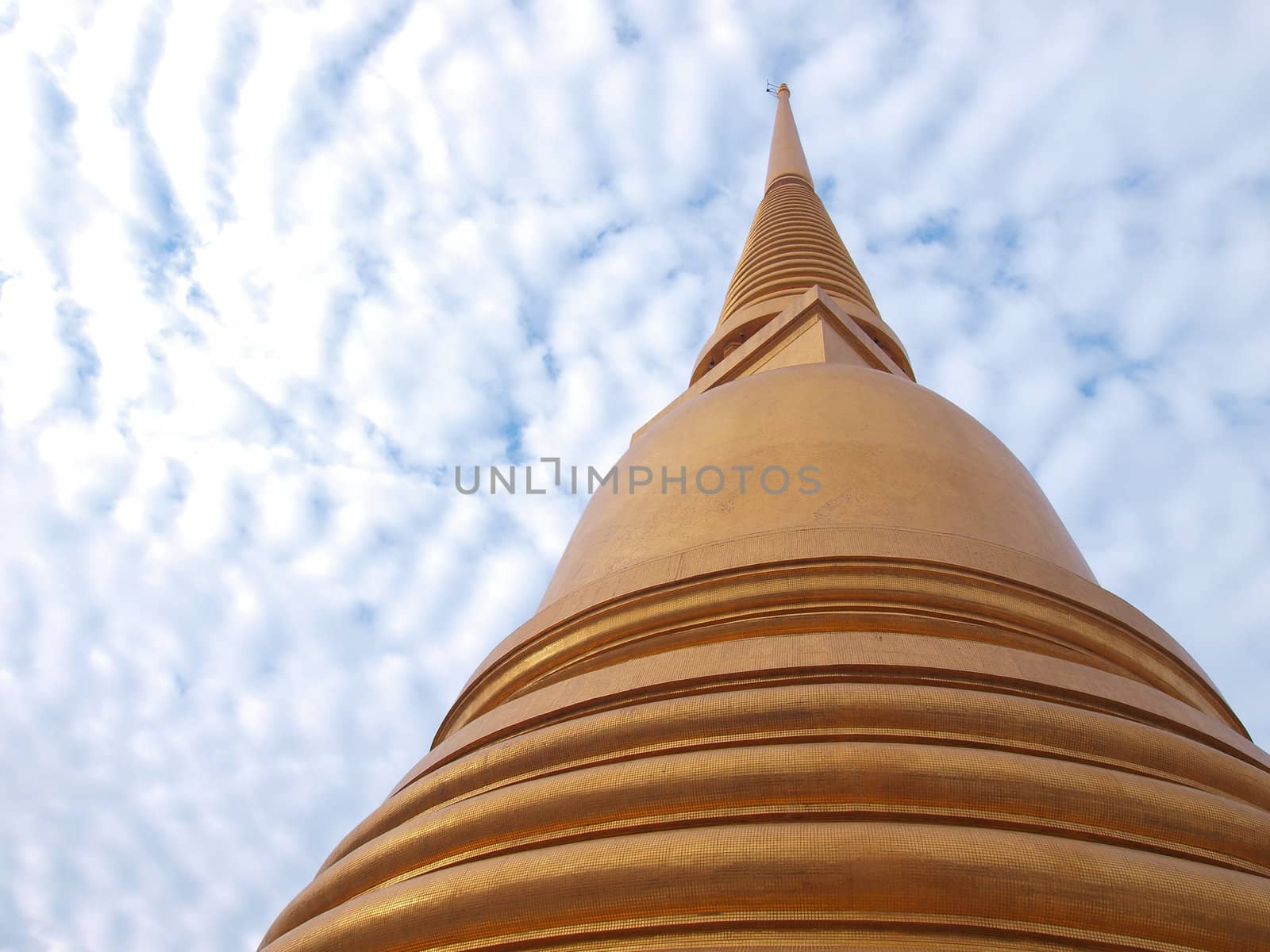 Golden Buddha Pagoda on blue sky by jakgree