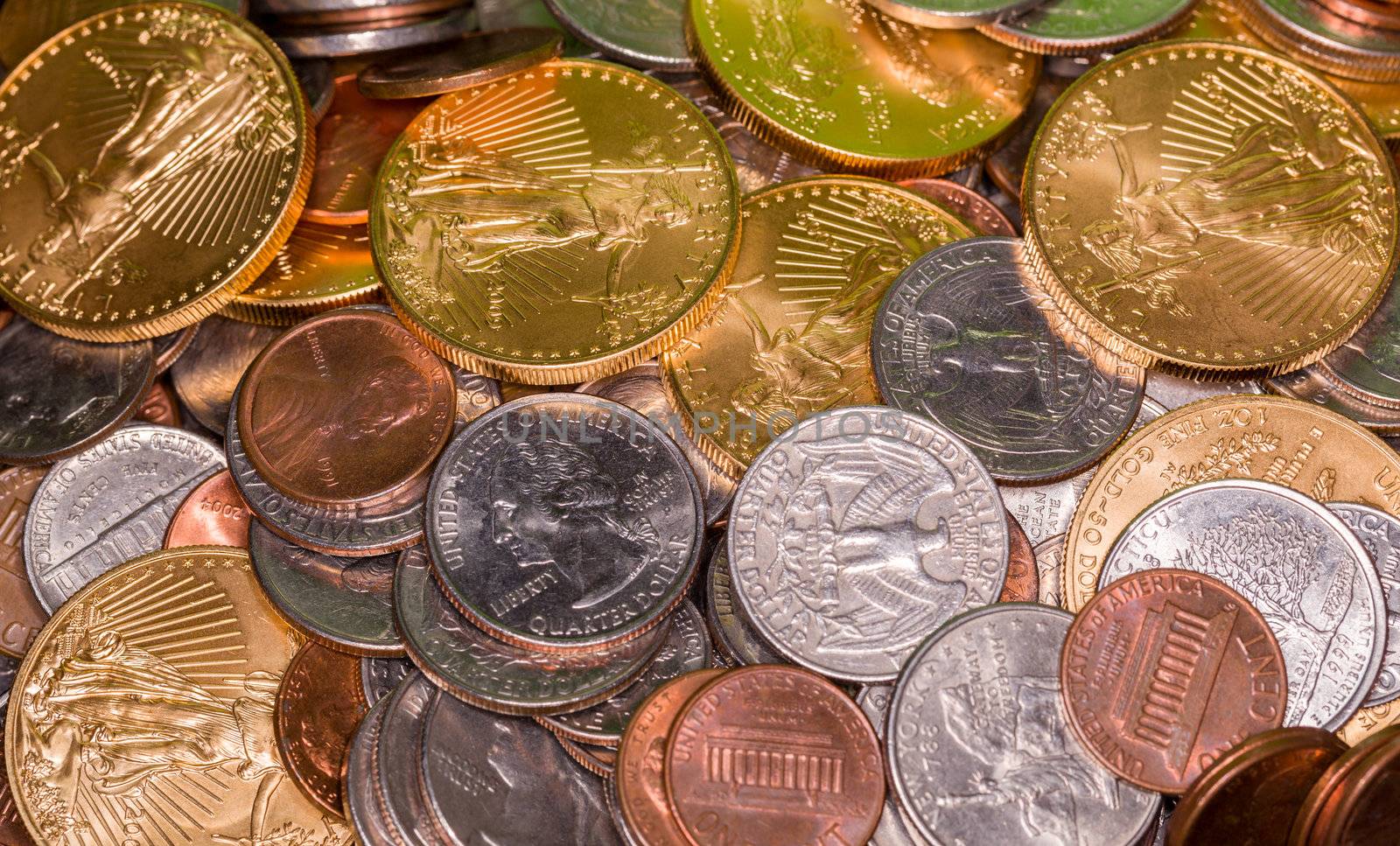 Solid gold eagle coins mixed with US quarters and cents