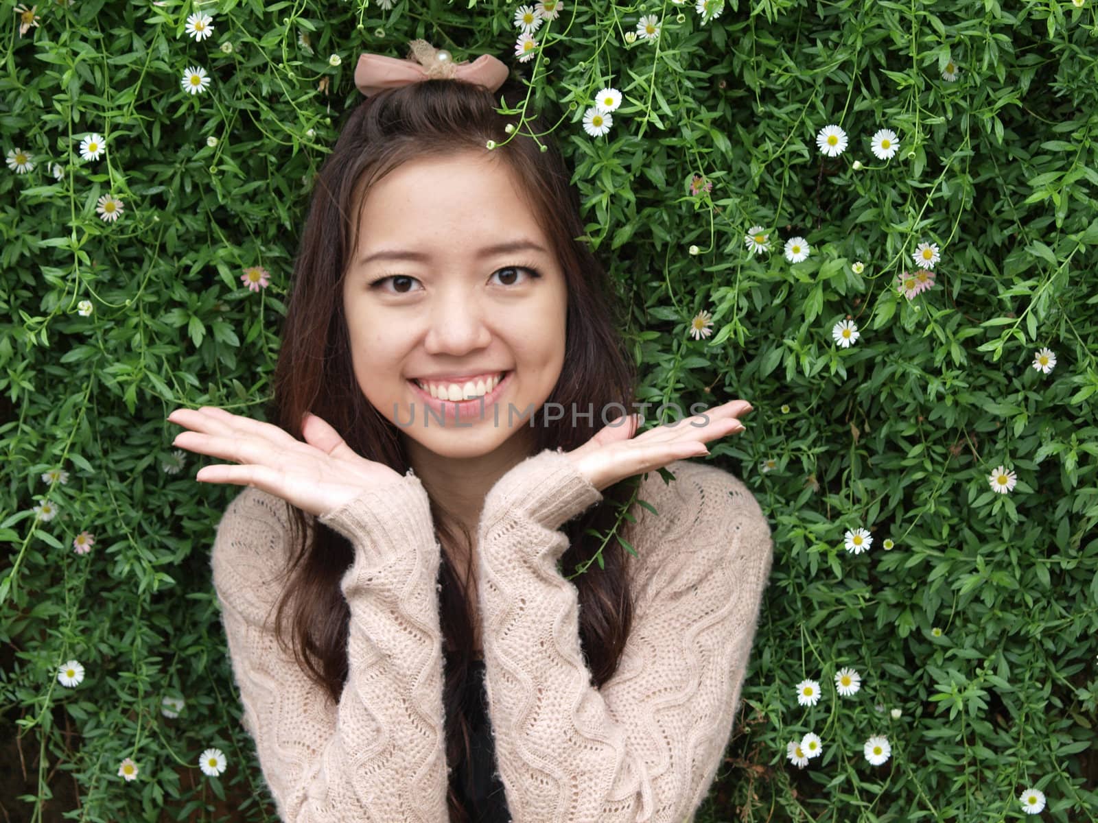 A smile of Asia beautiful girl  on a background of green nature by jakgree