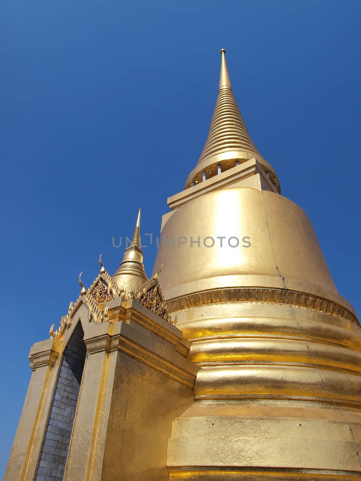 Golden pagoda in Grand Palace ,Bangkok Thailand      by jakgree