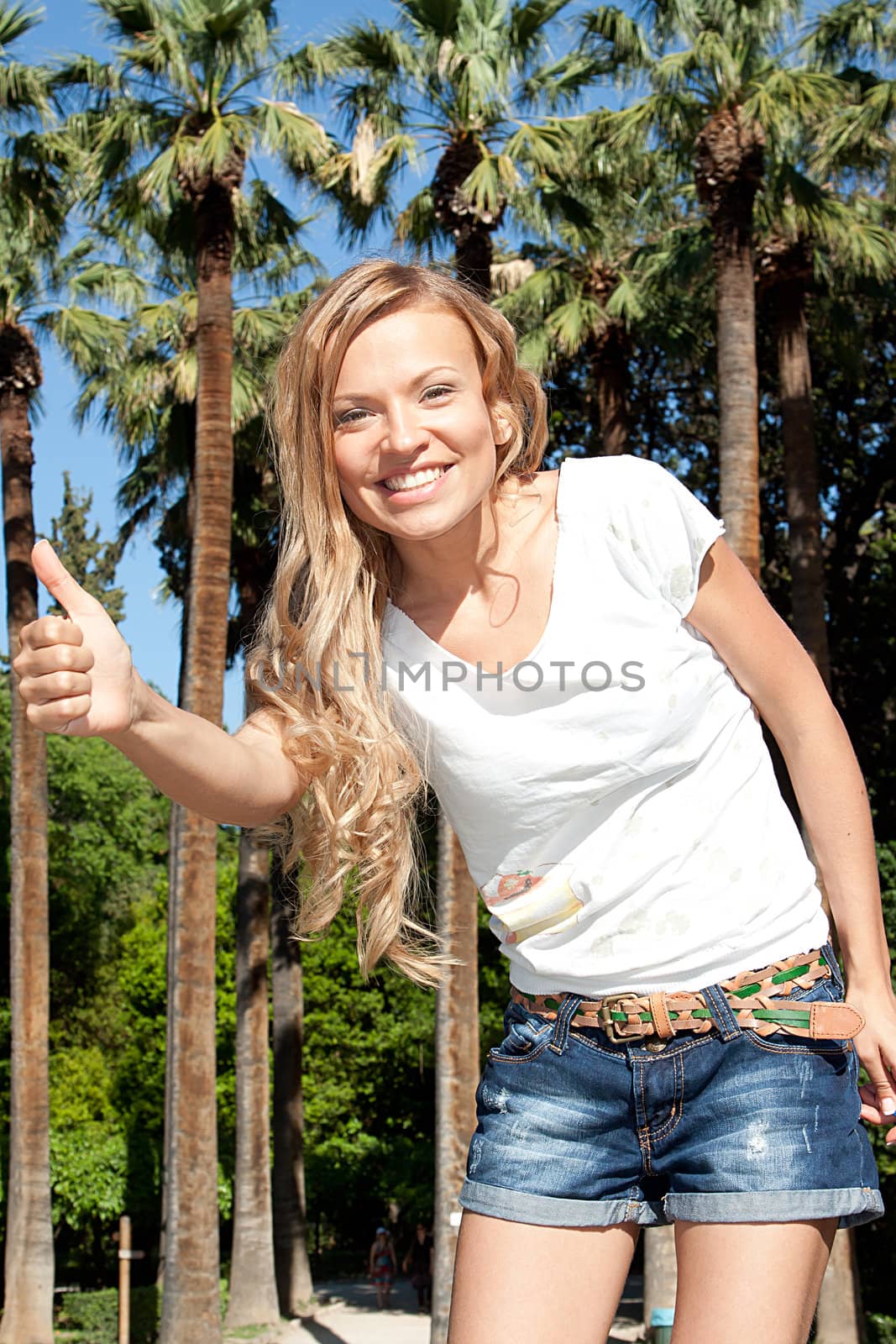 Photo of a young and beautiful girl walking down the street