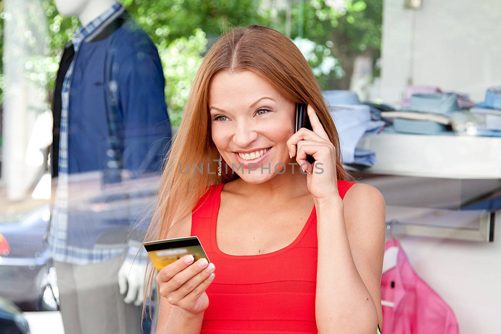 Photo of a young and beautiful woman who makes a purchase