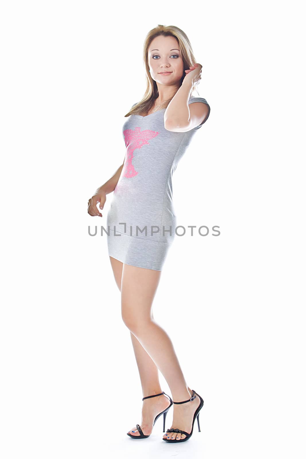 A young and beautiful woman in elegant dress isolated on white background