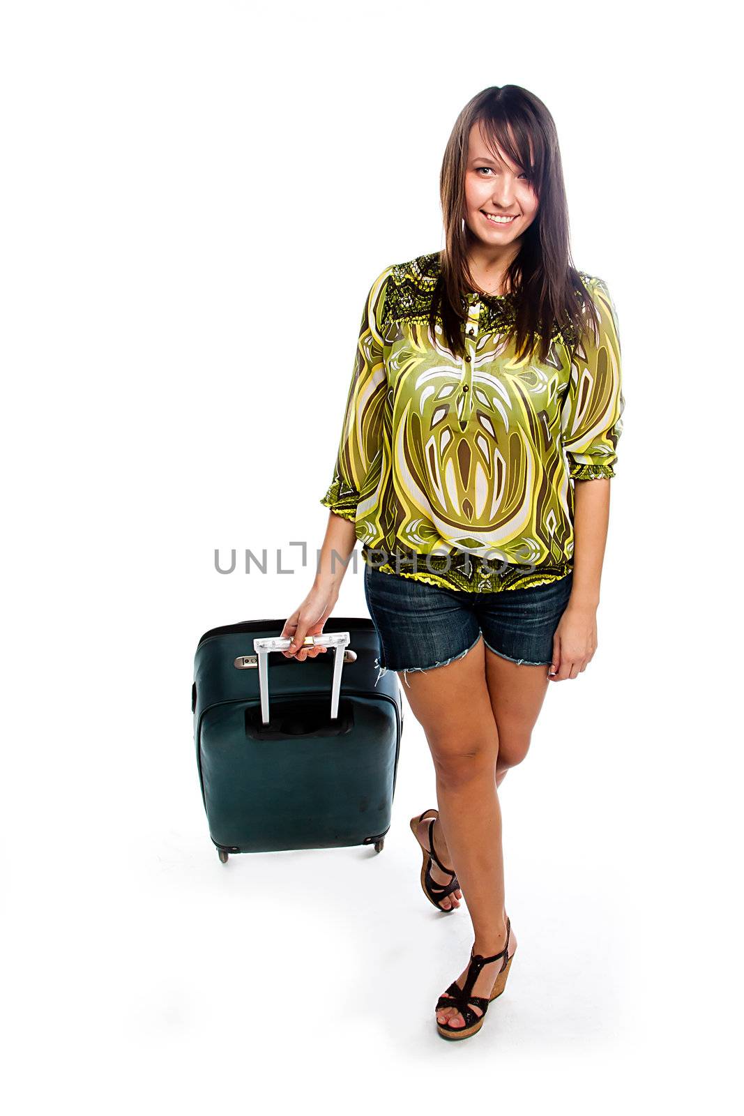 Photo of a young and beautiful girl with a suitcase, passport and ticket isolated on white background