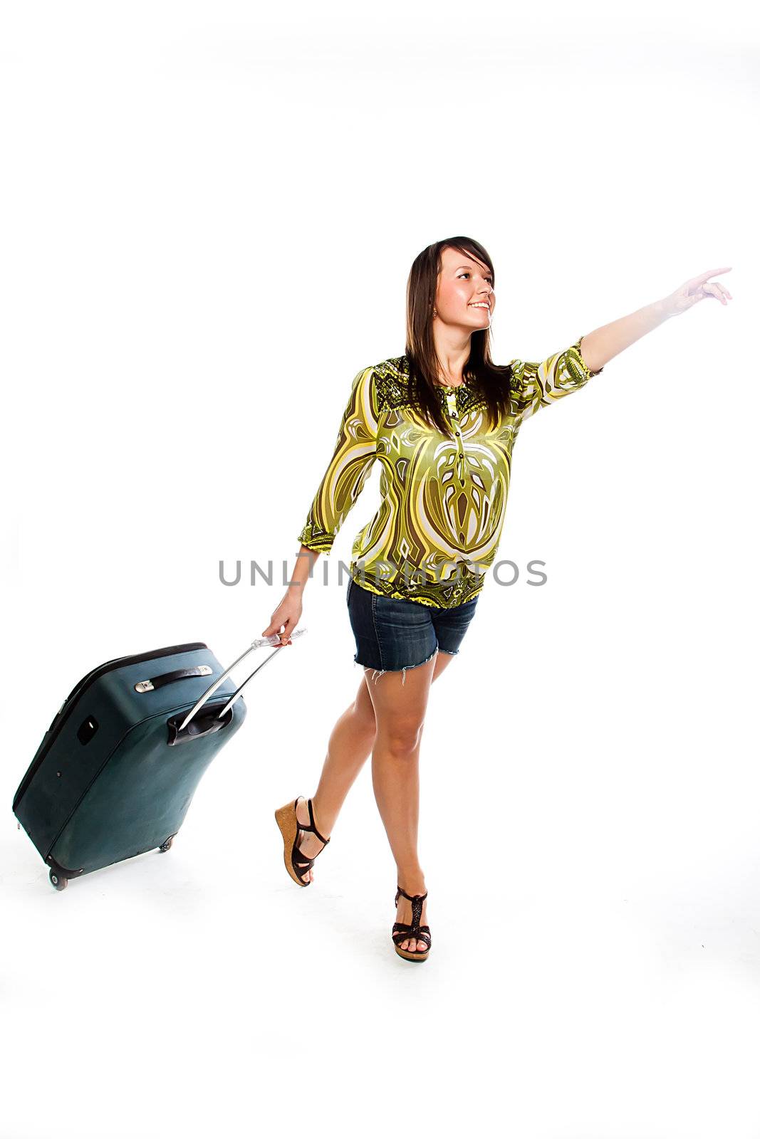 Photo of a young and beautiful girl with a suitcase, passport and ticket isolated on white background