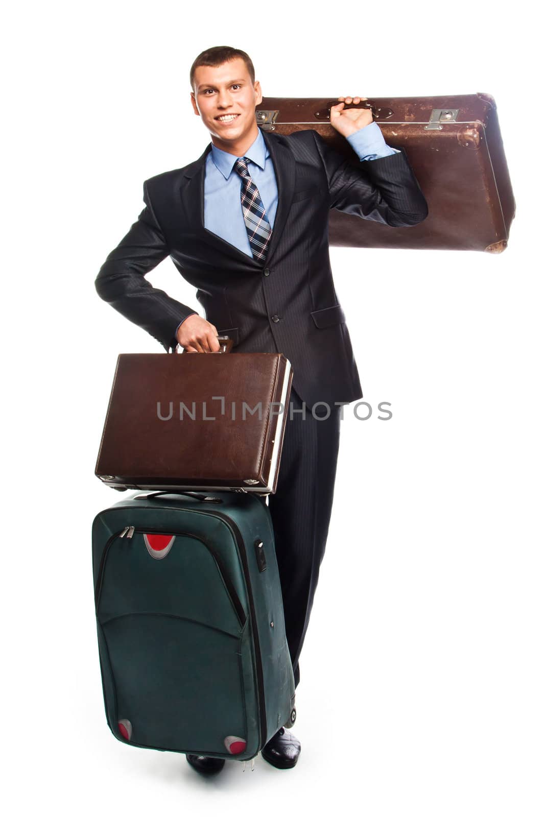 Young successful businessman in a business suit with three suitcases and a journey