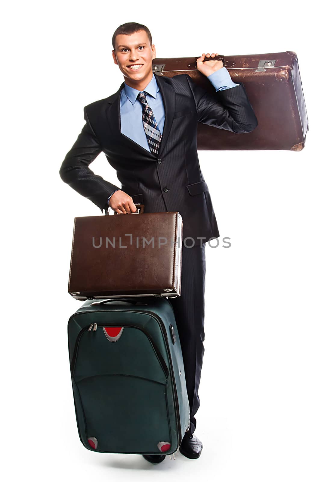 Young successful businessman in a business suit with three suitcases and a journey