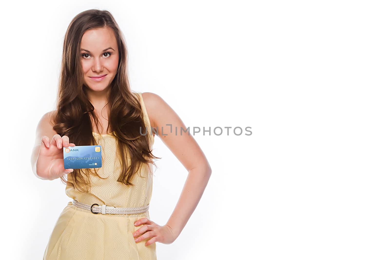 Young and beautiful girl with a credit card in the hands of blue