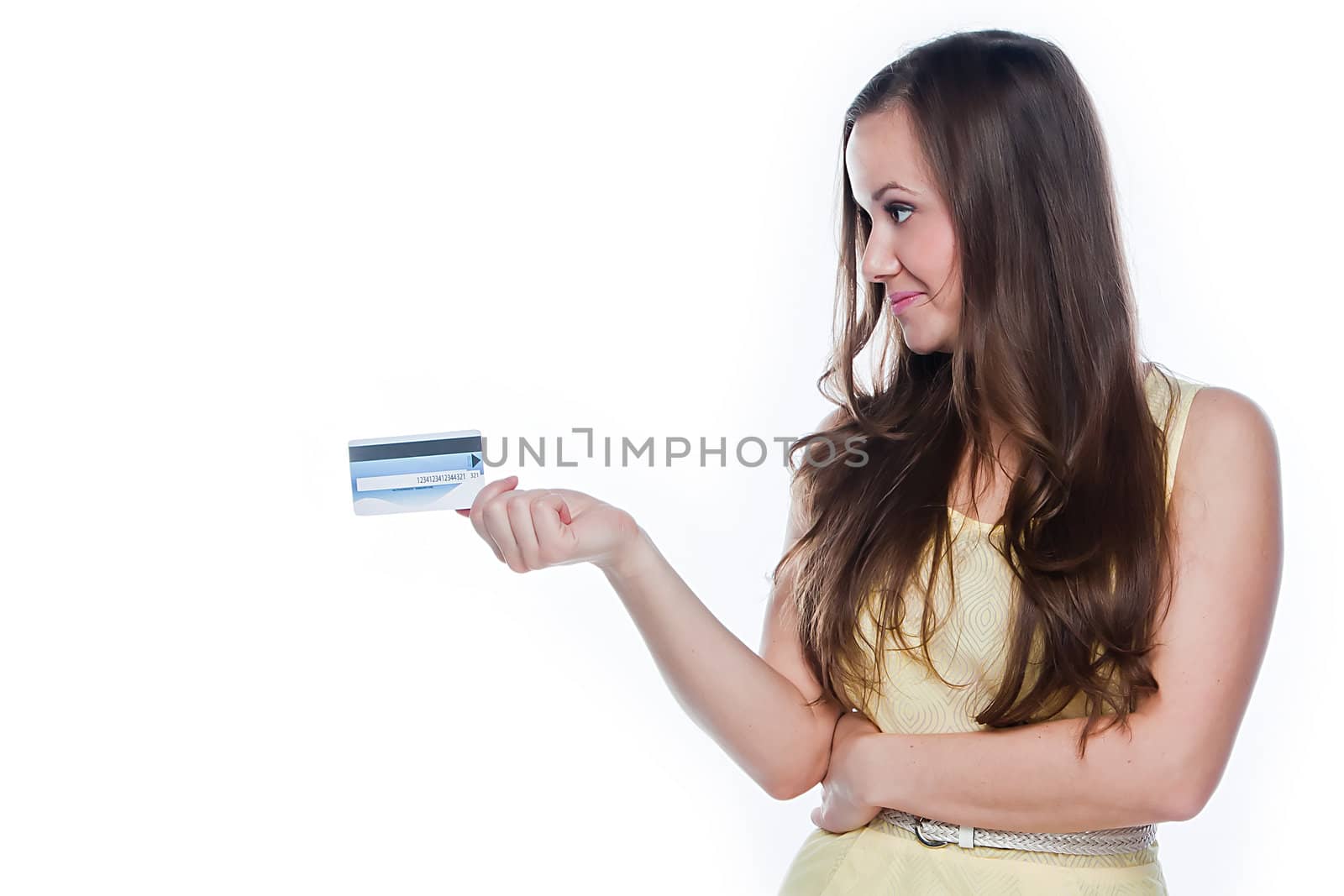 Young and beautiful girl with a credit card in the hands of blue