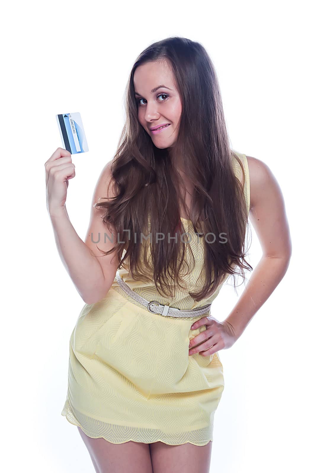 Young and beautiful girl with a credit card in the hands of blue