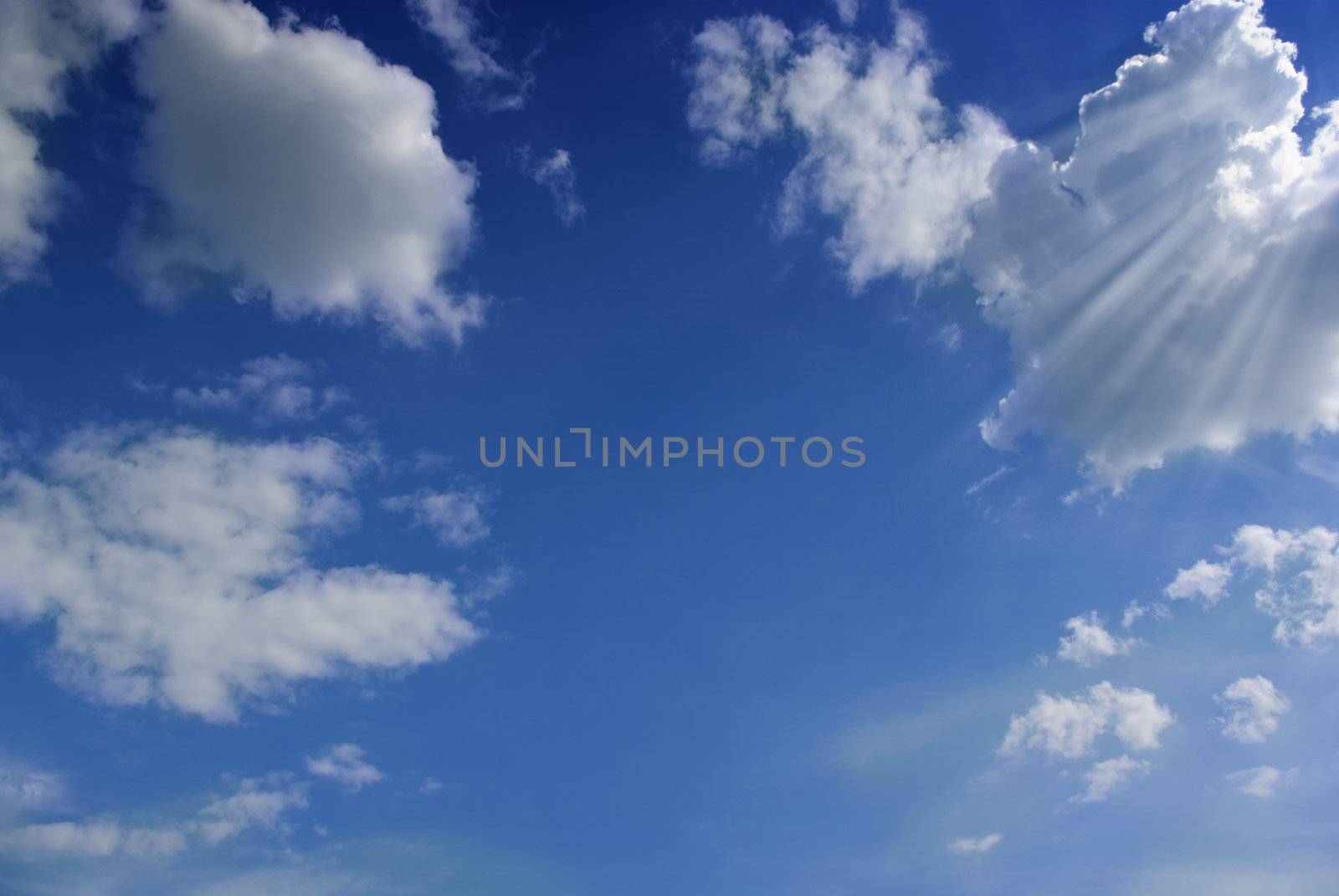 Blue sky with white fluffy clouds