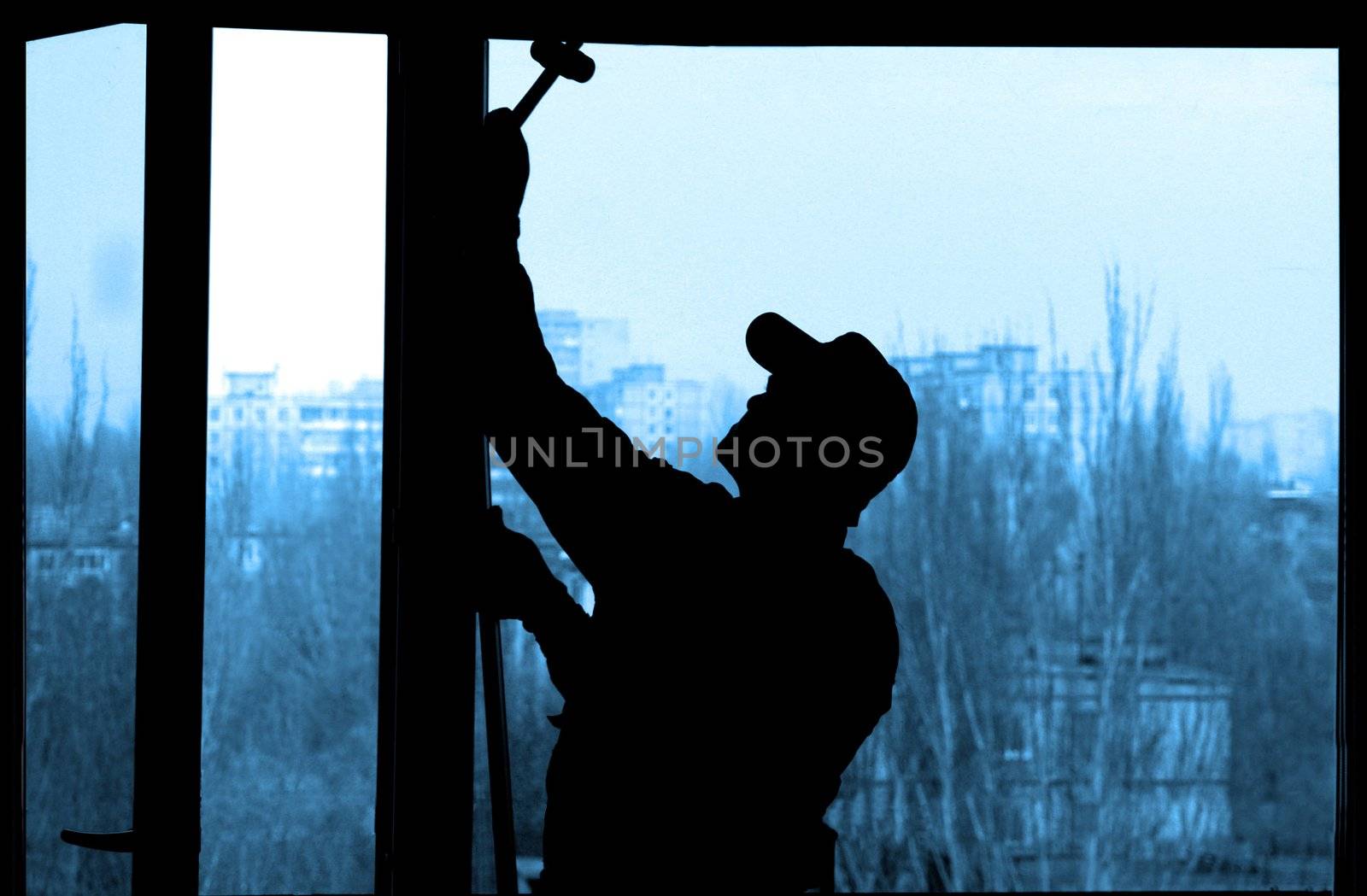 Installation of a window on a background of the house                               