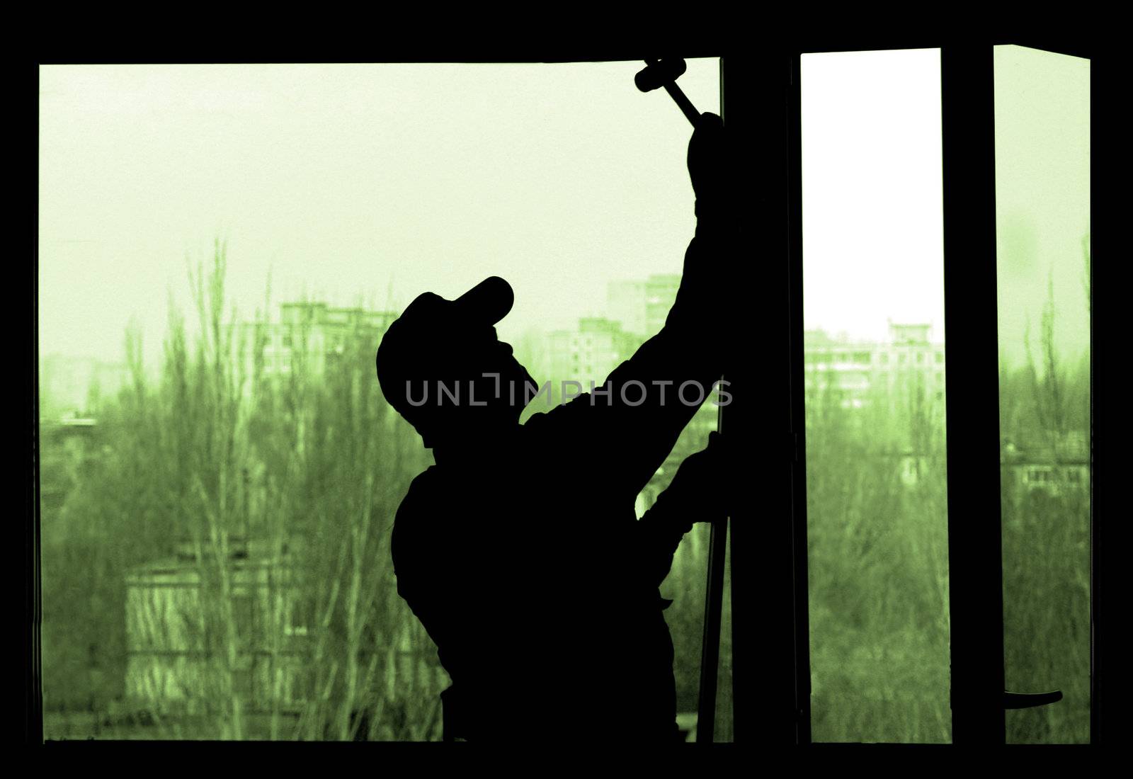 Installation of a window on a background of the house                               