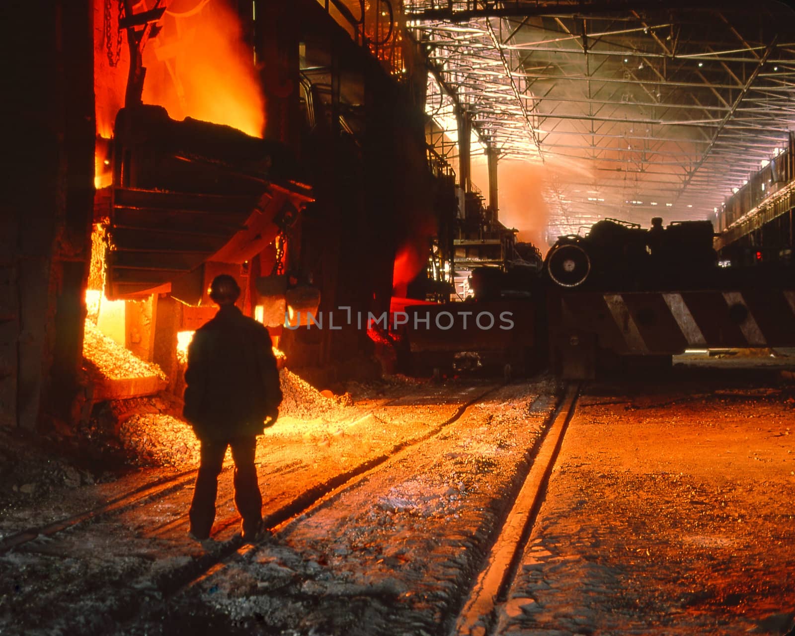  worker on a background of flood of steel