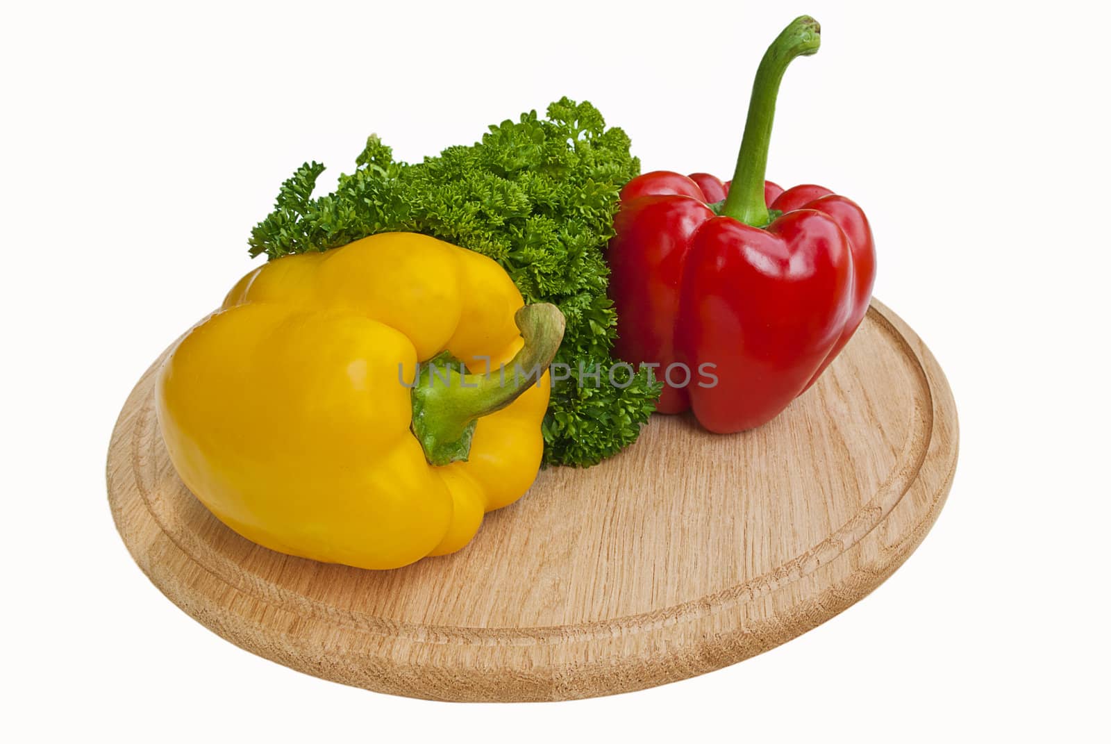 Two paprika on cutting board isolated on white