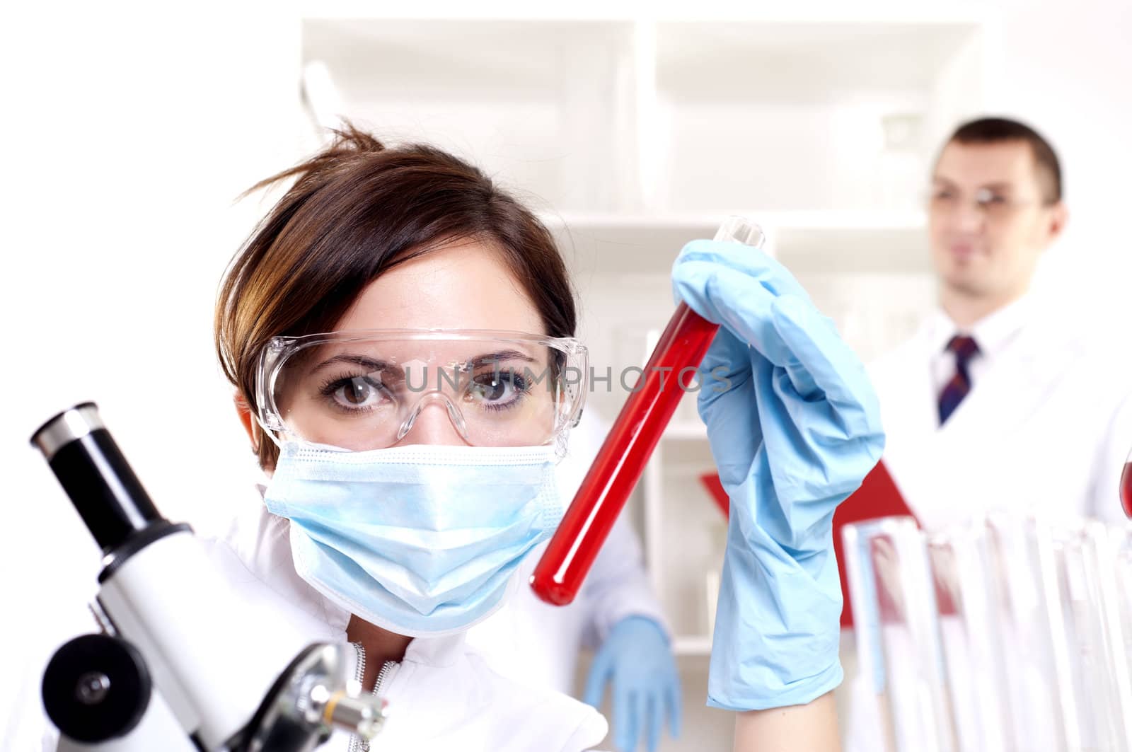 chemist working in the laboratory, mix liquid