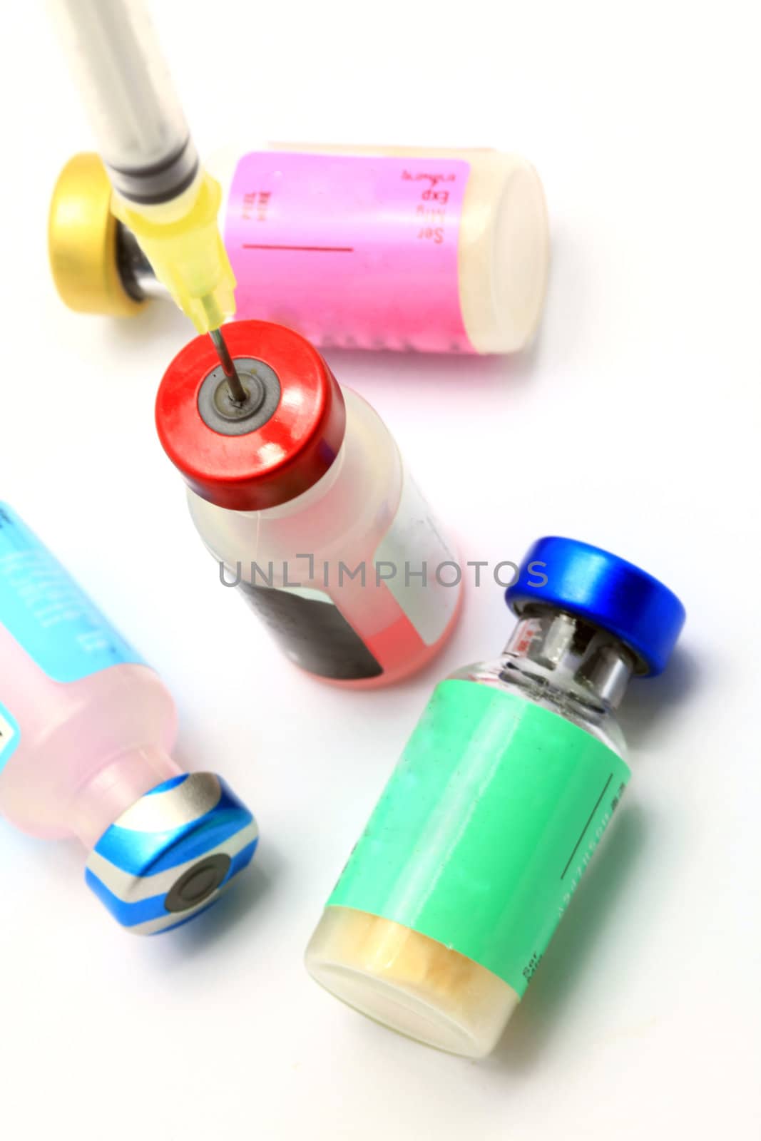 Macro shot of Medical Vaccine and Hypodermic Syringe on white background