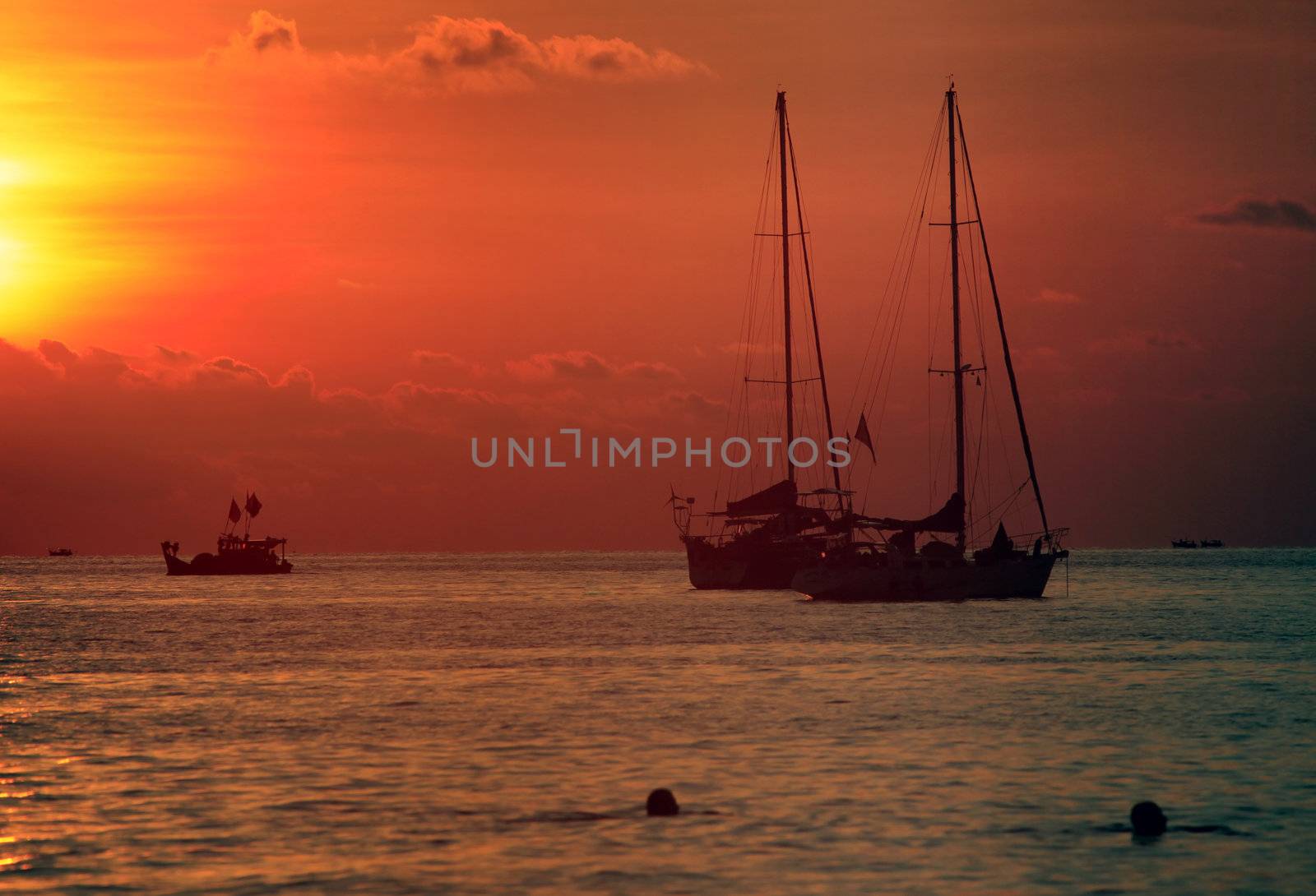 Sailing boats on a background of a beautiful sunset. Malaysia
