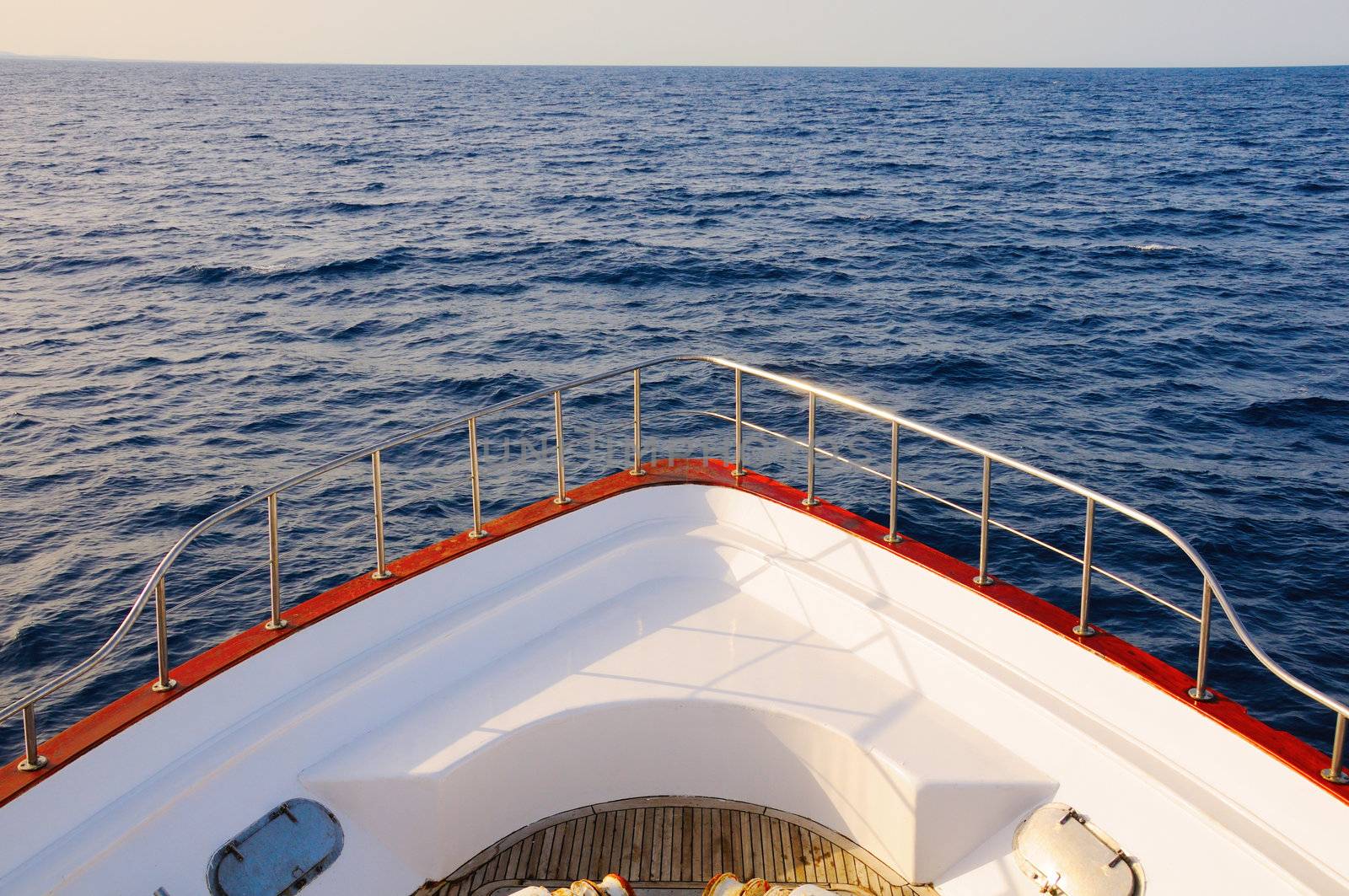 Prow of big wooden yacht in the sea