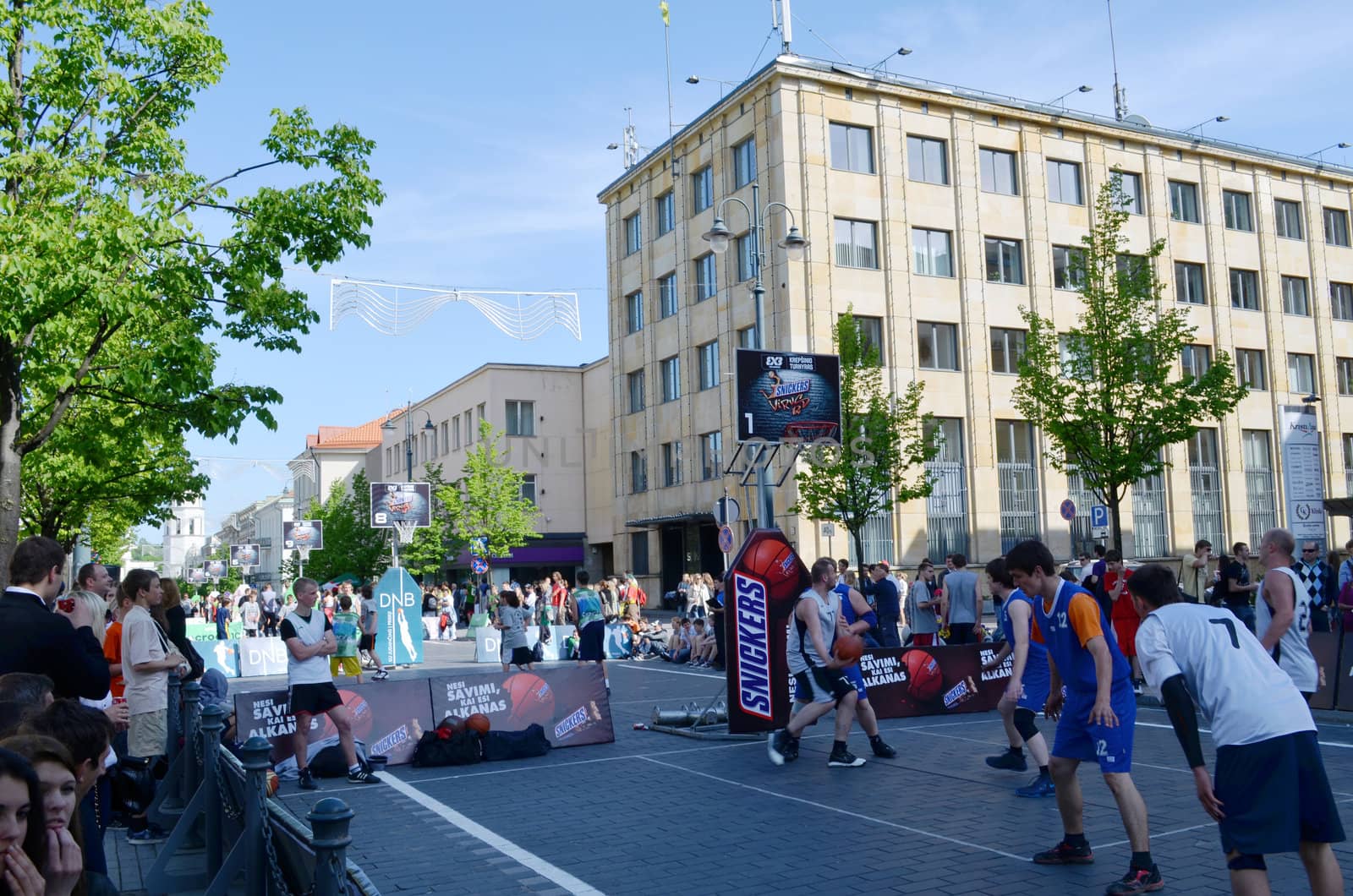 VILNIUS, LITHUANIA MAY 2012. People playing basketball in Gediminas prospect. Outside street basketball tournament 3x3.