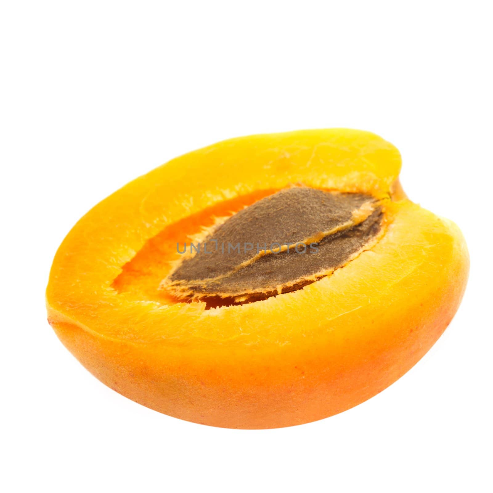 A half of apricot fruit isolated on white