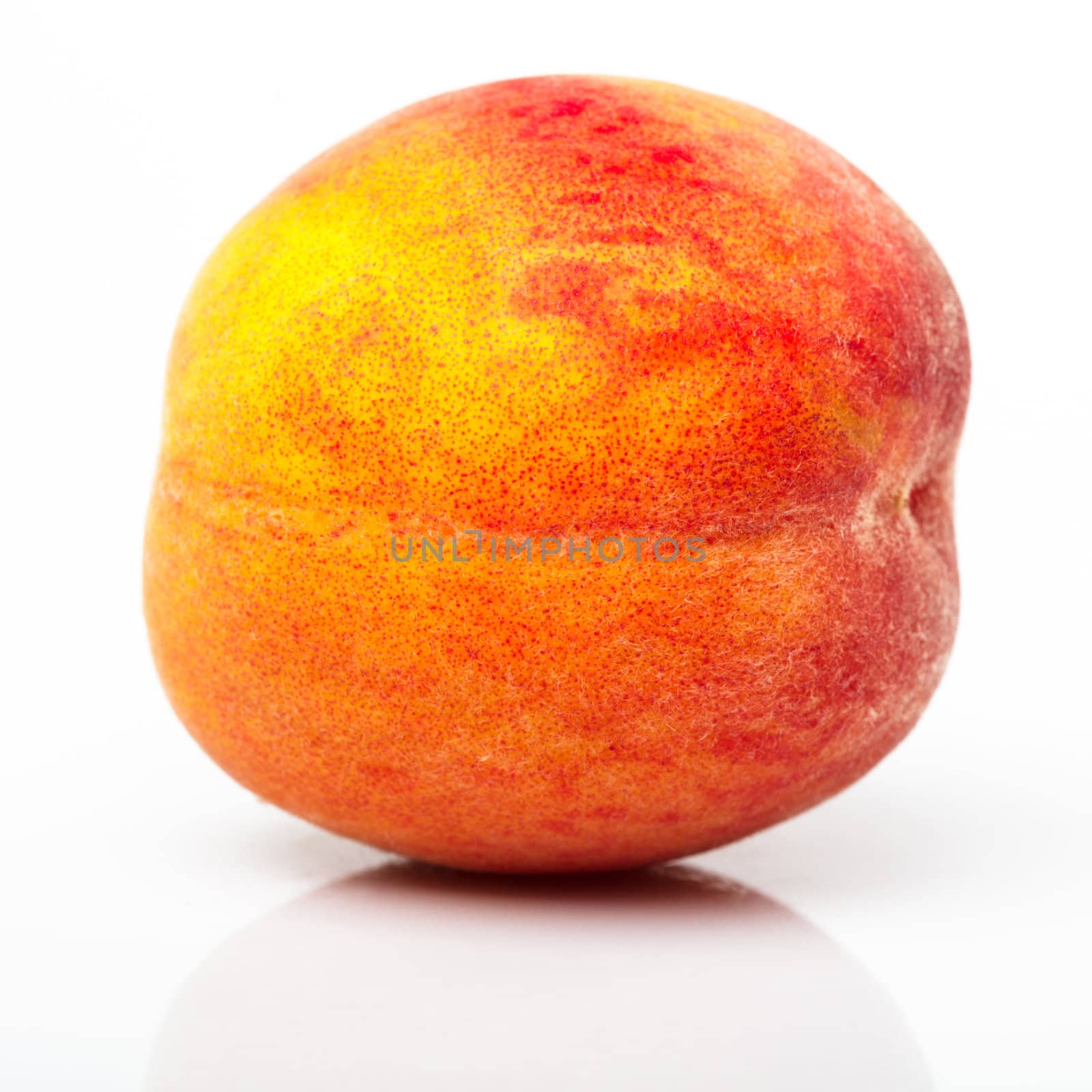 One peach closeup isolated on white background