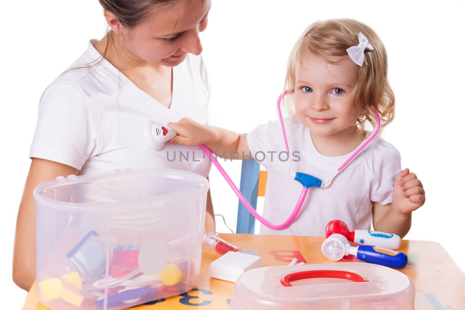 Mother and daughter playing doctor with stethoscope by Angel_a