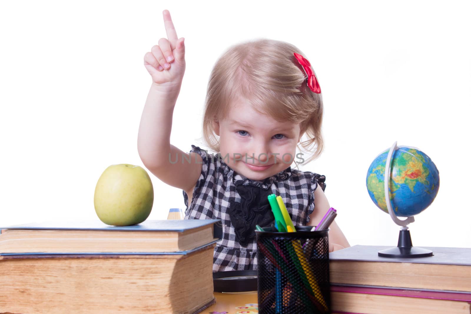 Cute girl in classroom raising finger up over white