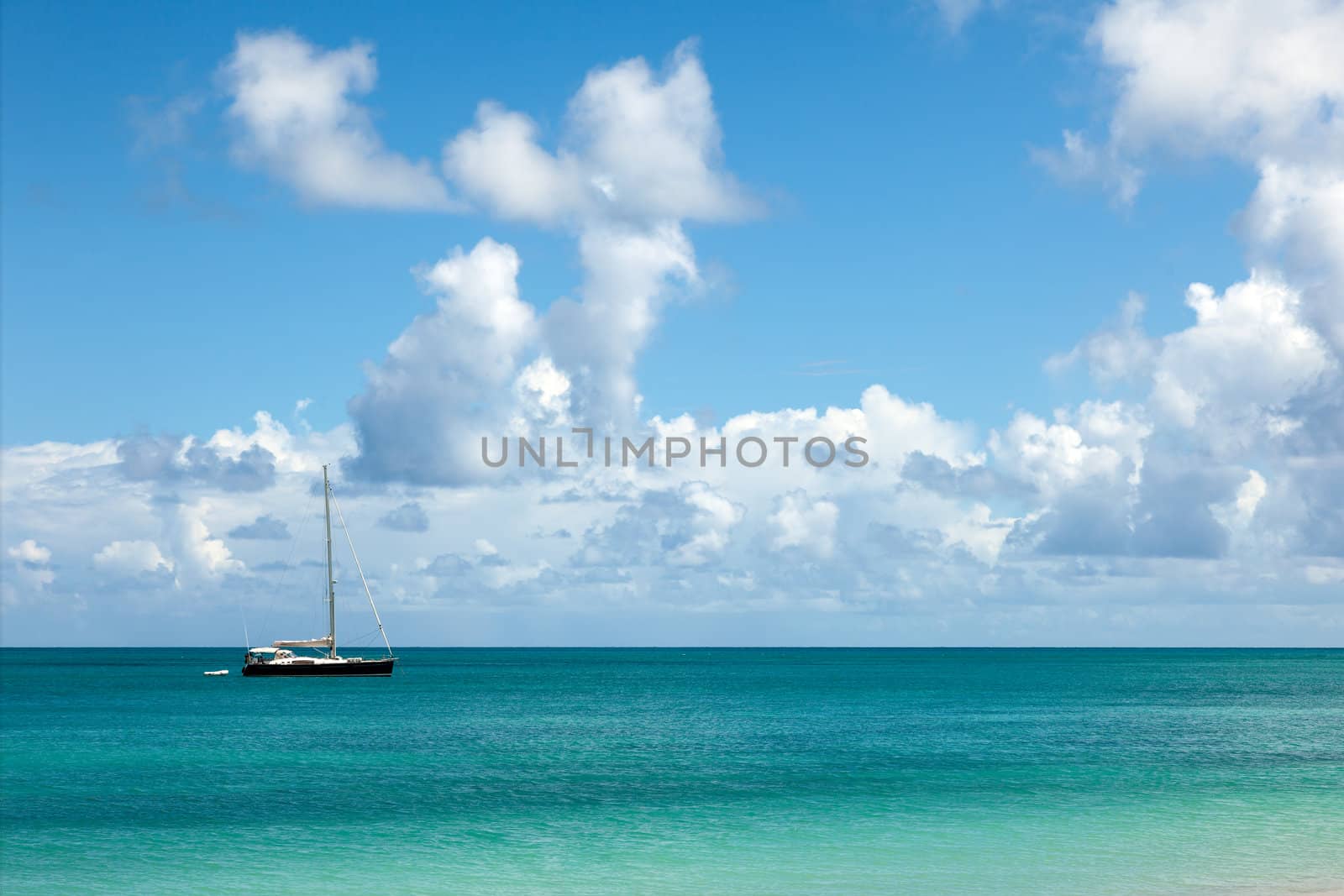 Beautiful Sunny Seascape with Anchored Yacht and Blue Sky with Fluffy Clouds