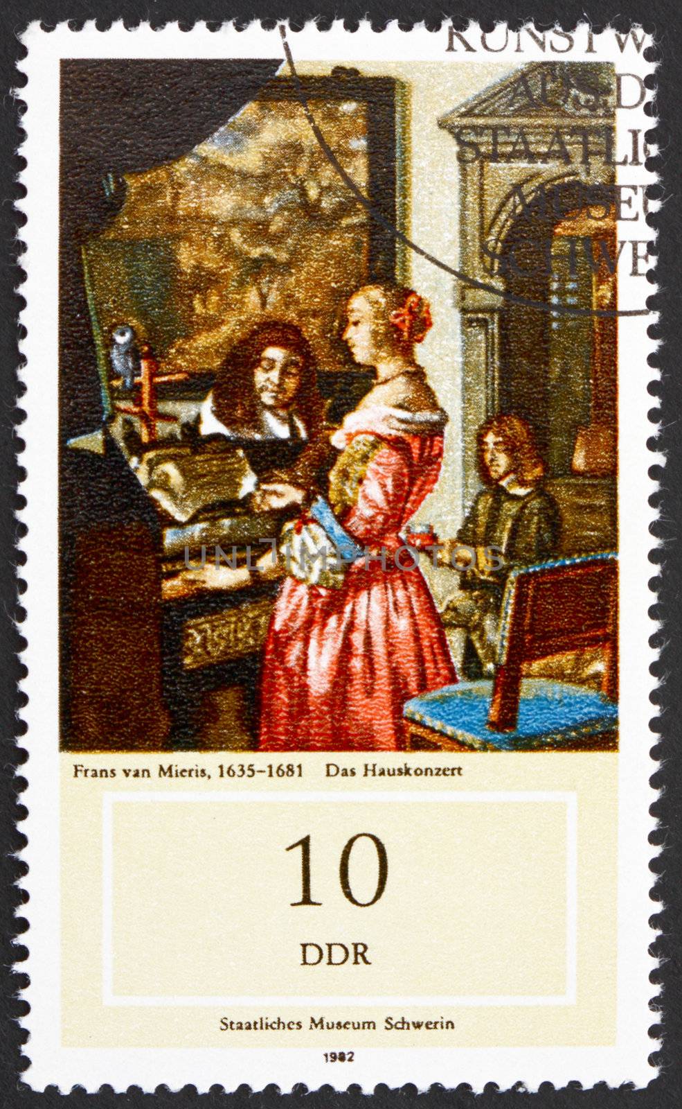 GDR - CIRCA 1982: a stamp printed in GDR shows Music Making at Home, Painting by Frans van Mieris, circa 1982