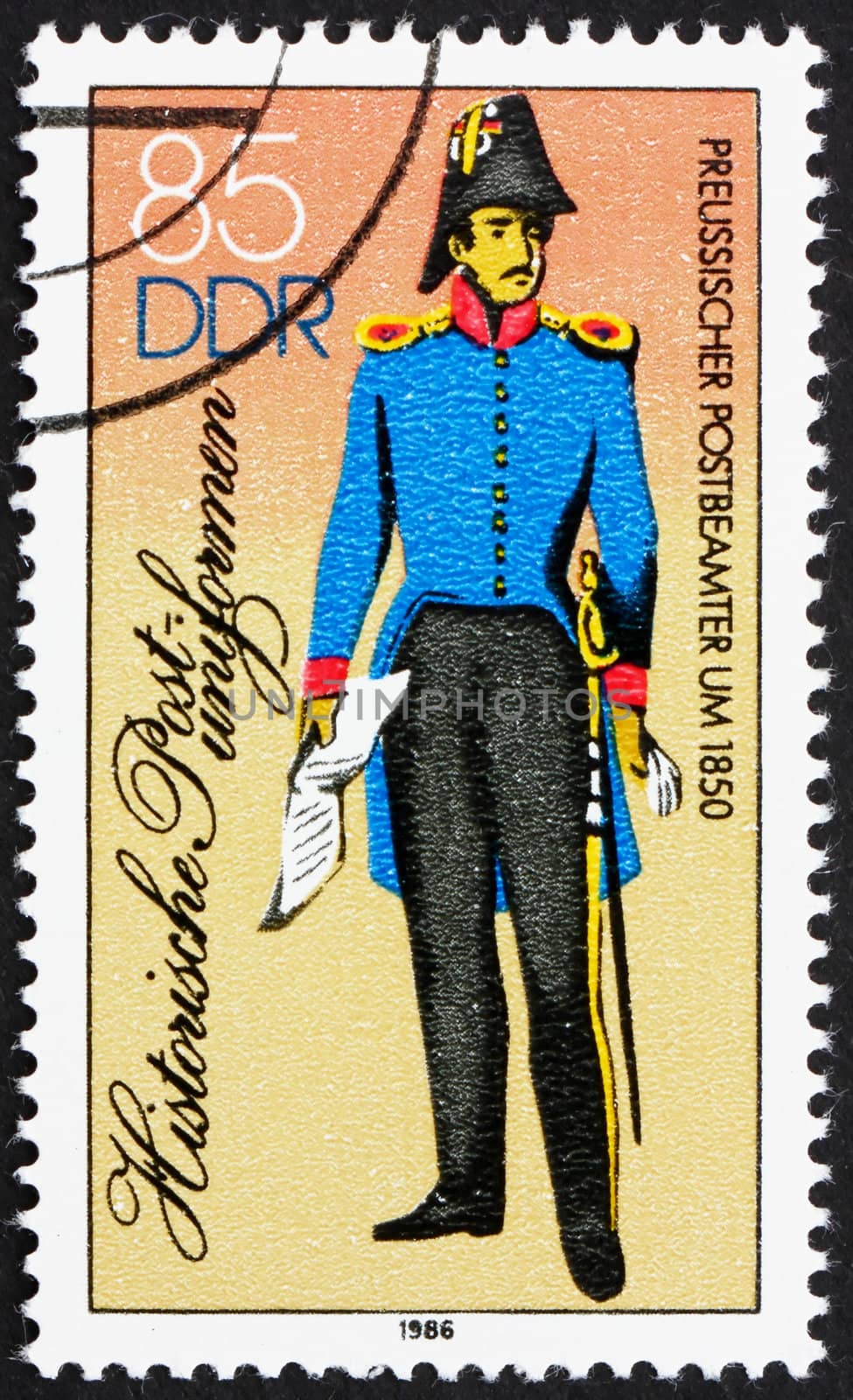 GDR - CIRCA 1986: a stamp printed in GDR shows Prussian P.O. Clerk, Postal Uniform 1850, circa 1986