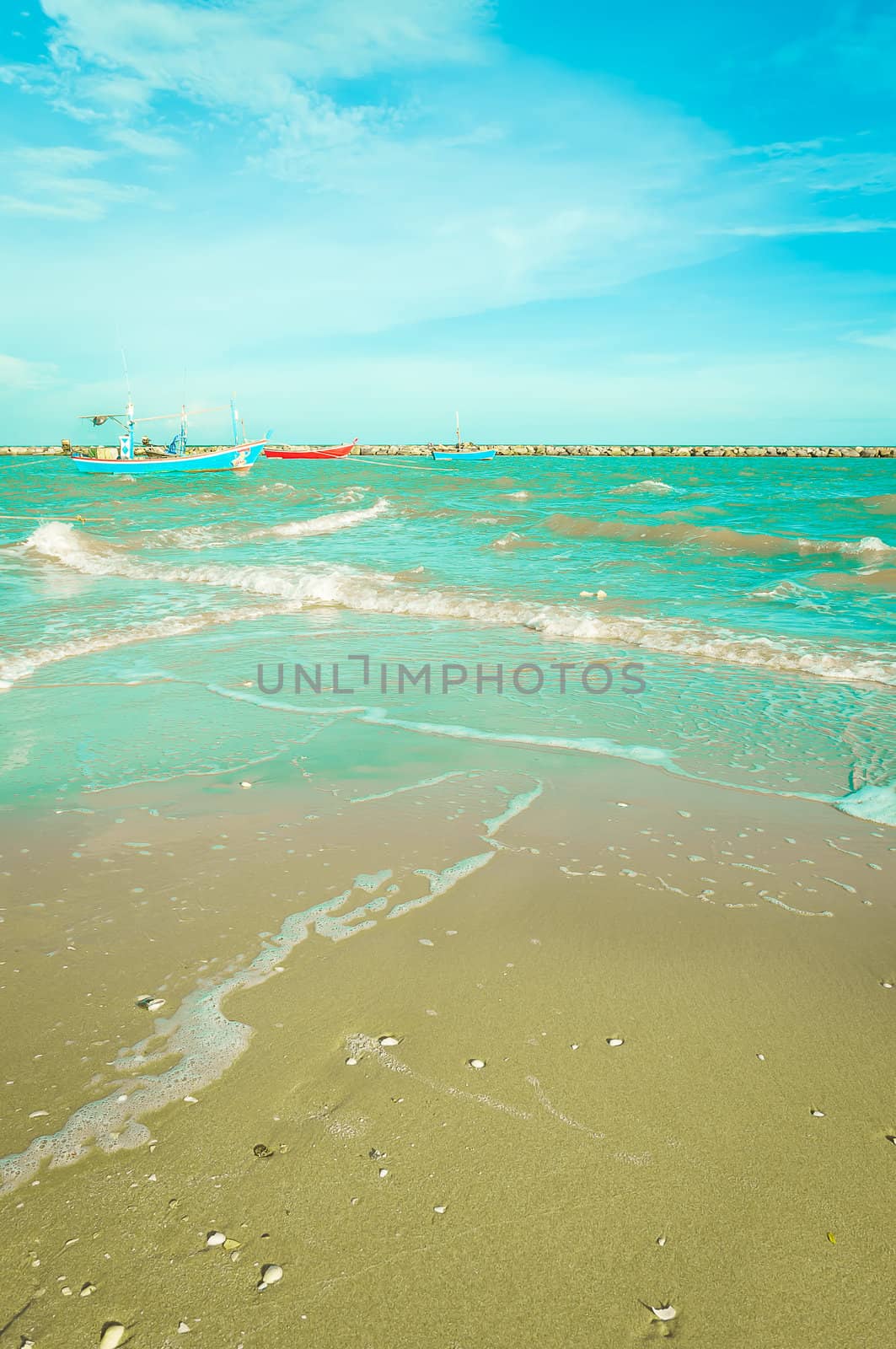 Blue boat on sea with blue sky