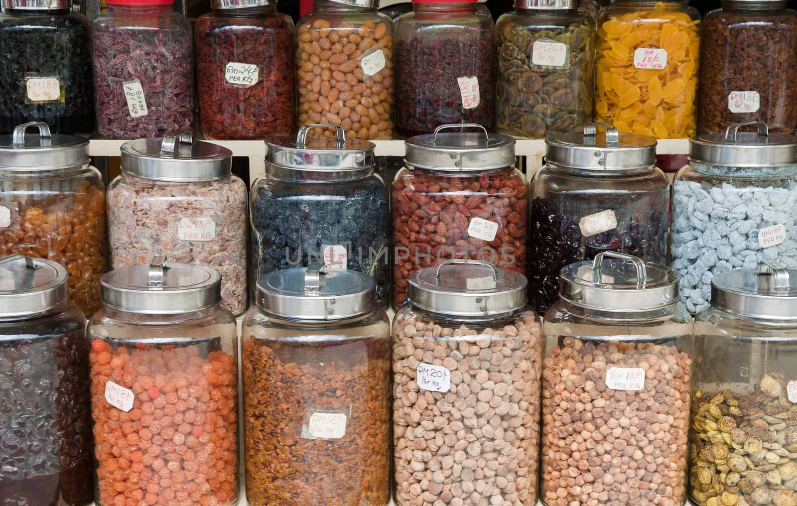 nuts beans and dried fruit in jars for sale