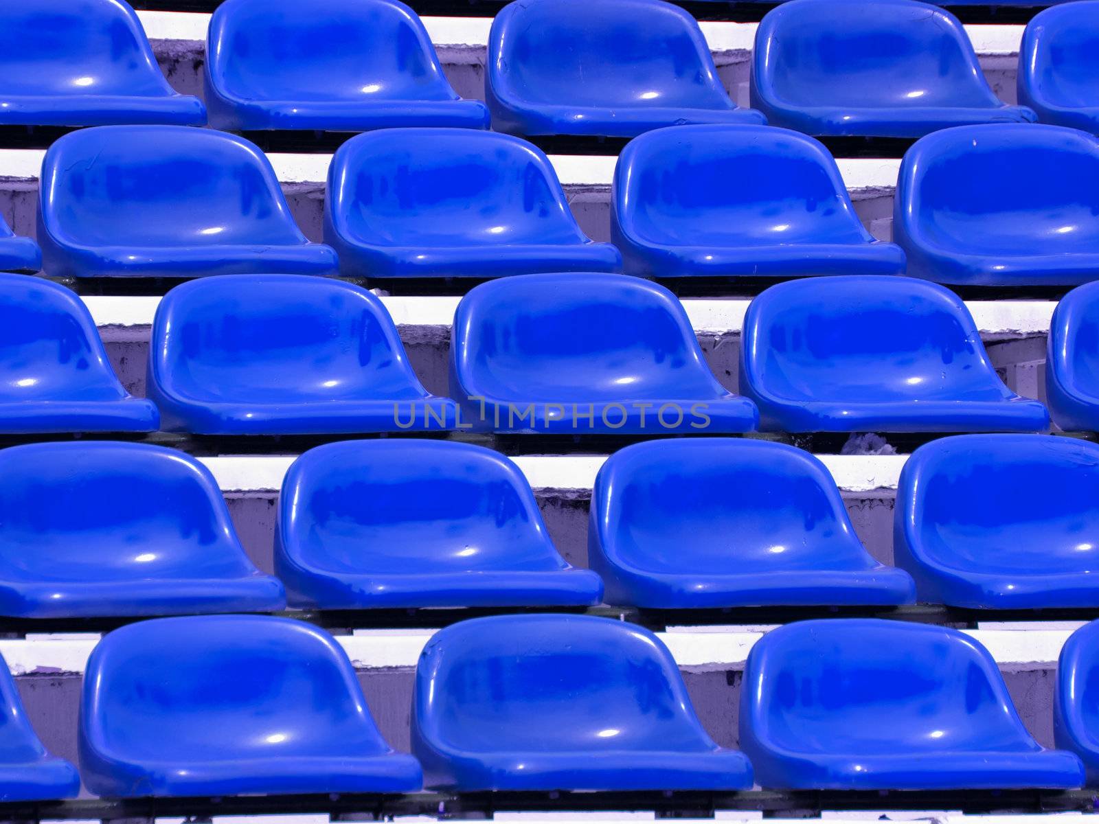 regular Blue seats in a stadium by jakgree