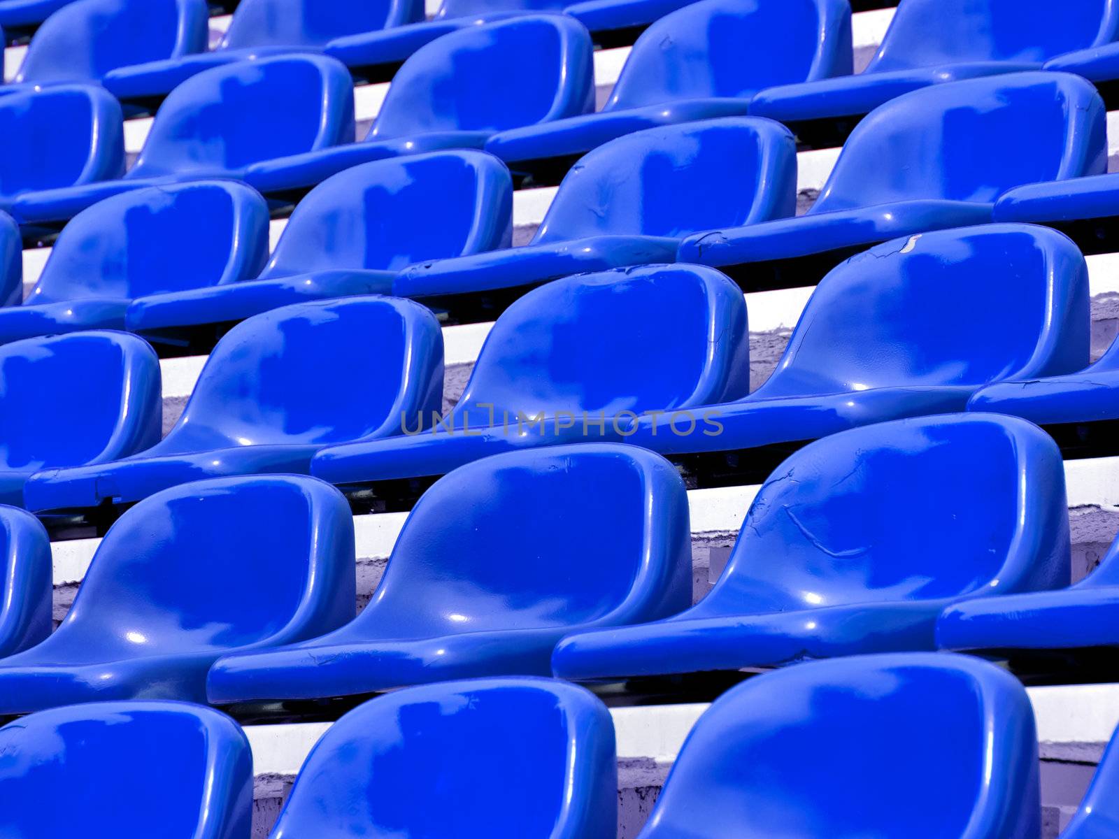 regular Blue seats in a stadium by jakgree