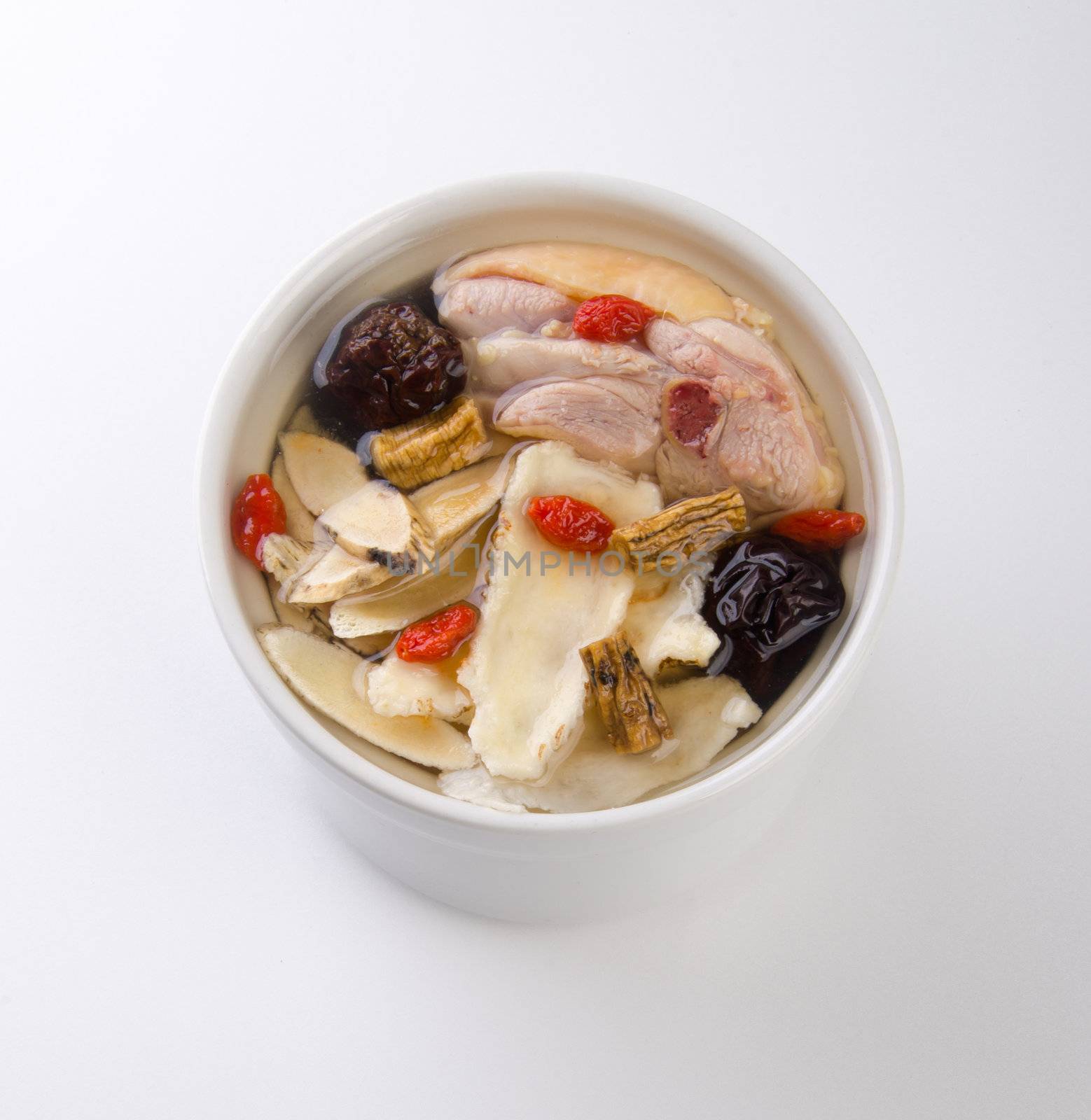 Chicken and herb soup in pot, Chinese food style.