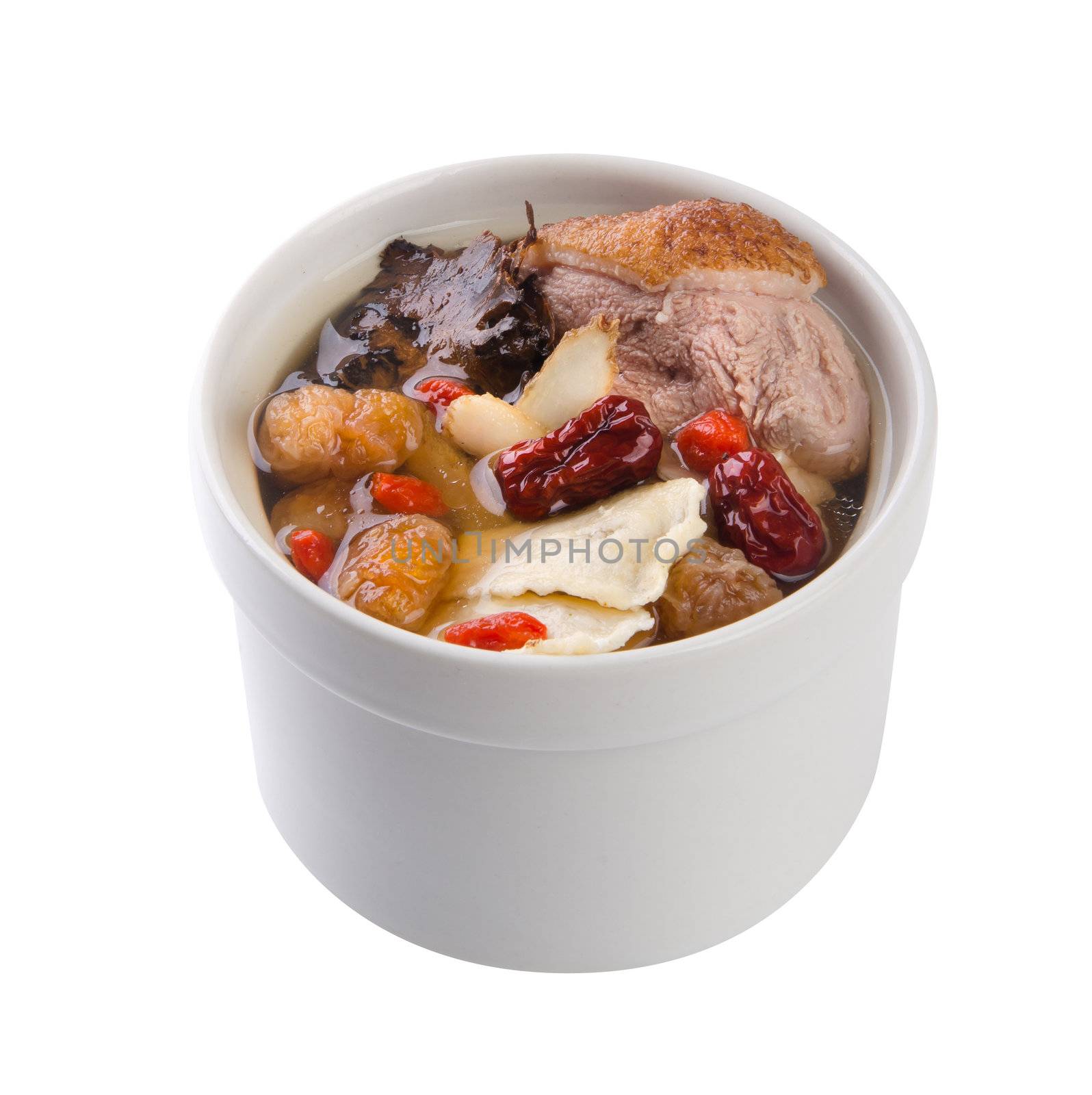 Chicken and herb soup in pot, Chinese food style.