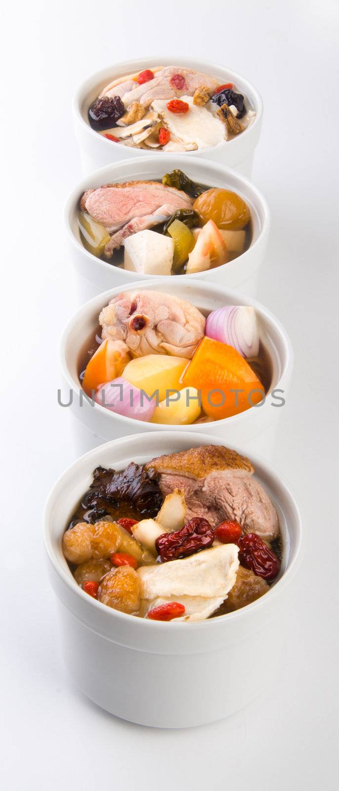 Chicken and herb soup in pot, Chinese food style.