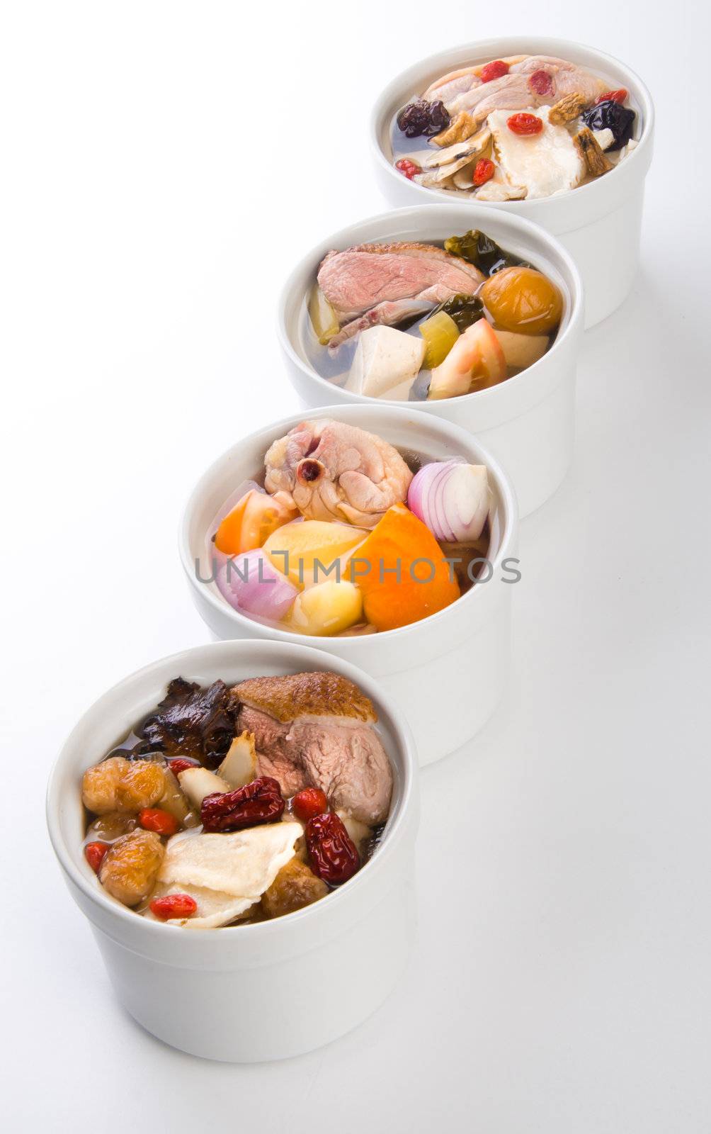 Chicken and herb soup in pot, Chinese food style.