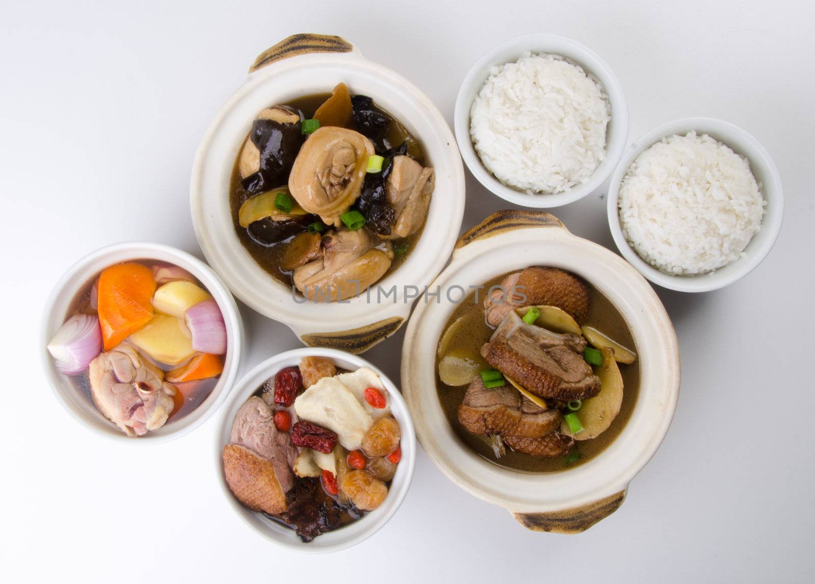 Chicken and herb soup in pot, Chinese food style.