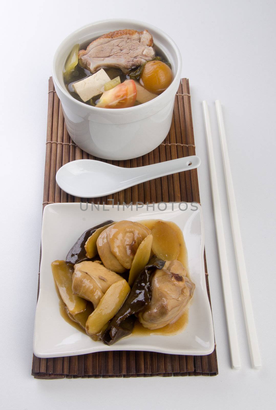 Chicken and herb soup in pot, Chinese food style.