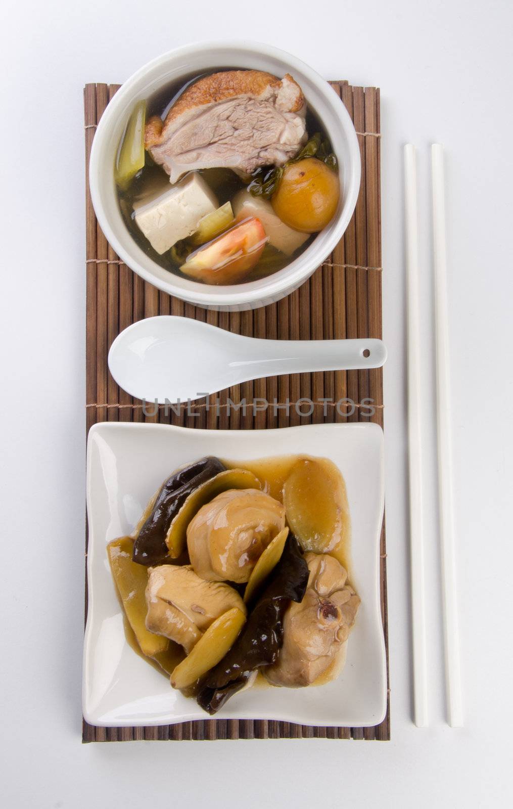 Chicken and herb soup in pot, Chinese food style.
