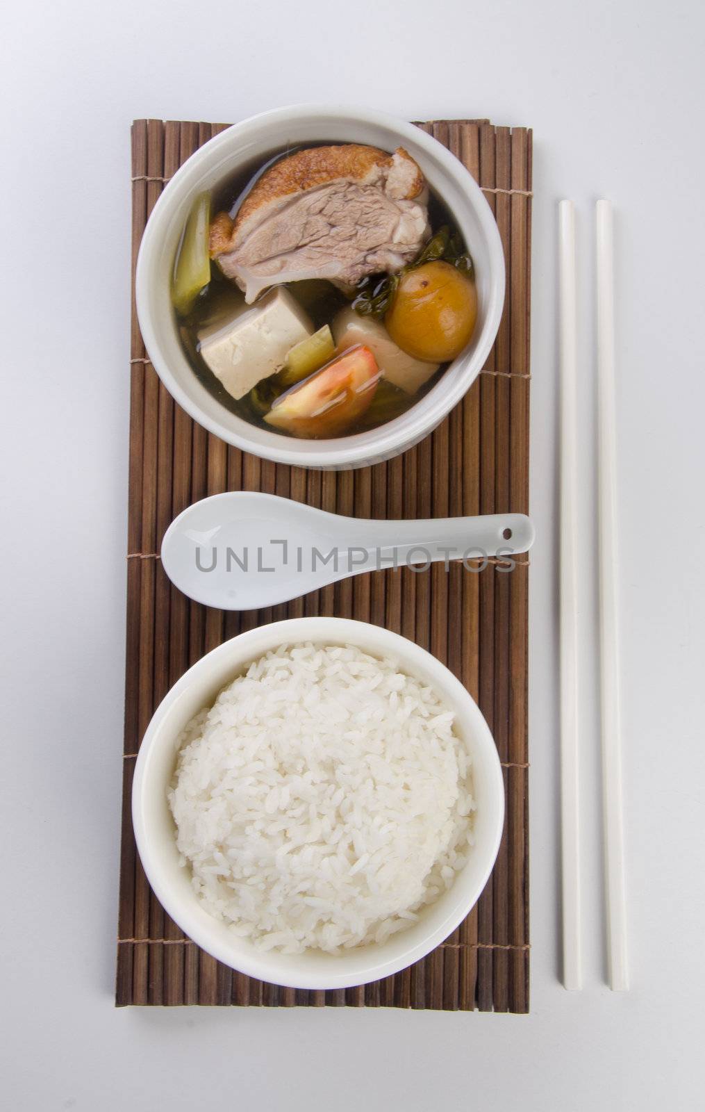 Chicken and herb soup in pot, Chinese food style.